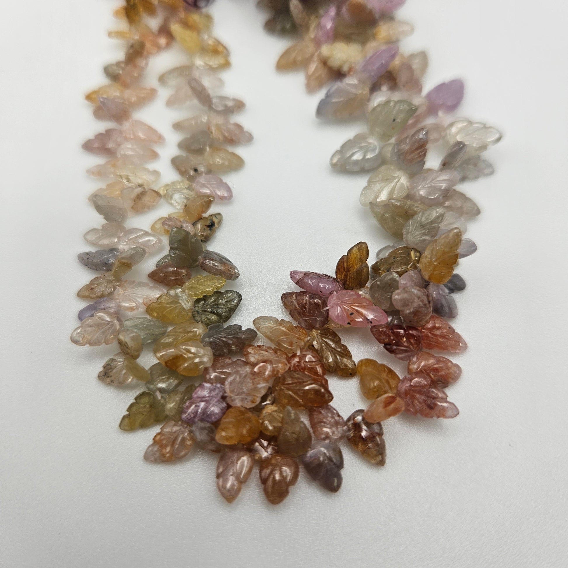 5-6mm Carved Sapphire Leaf Bead Strand.