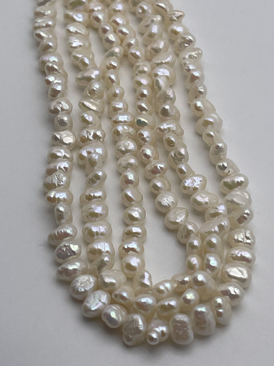 5-6mm White Flat Pearl Bead Strand.