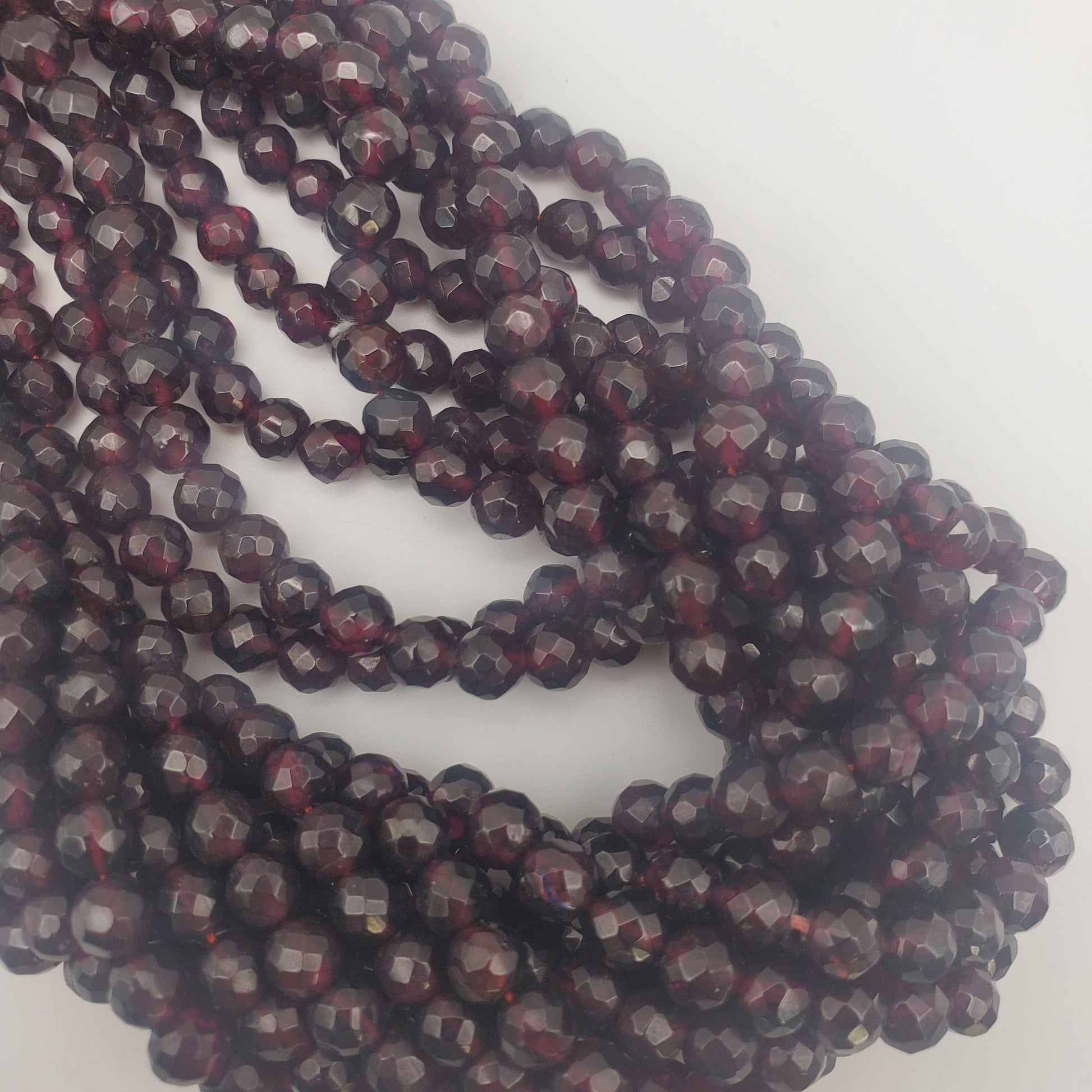 5mm Faceted Round Garnet Bead Strand.