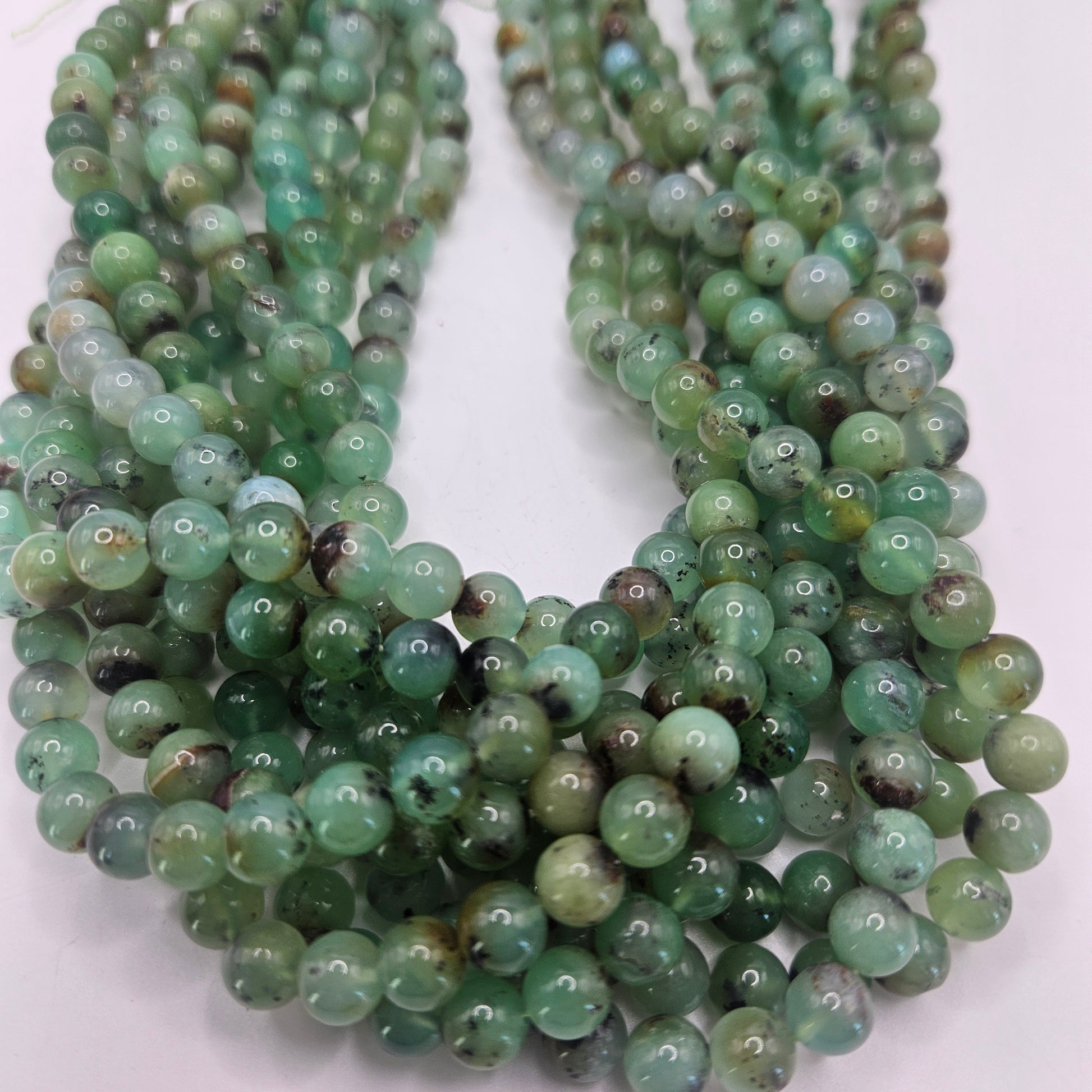 6mm chrysoprase round smooth.