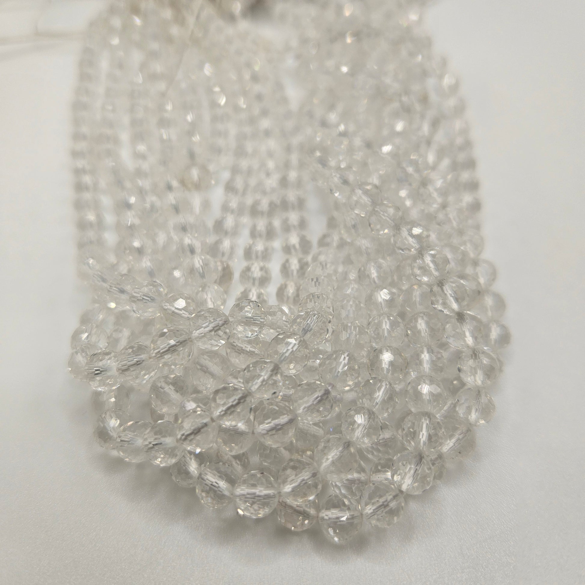 6mm Clear Quartz Faceted Round Bead Strand.