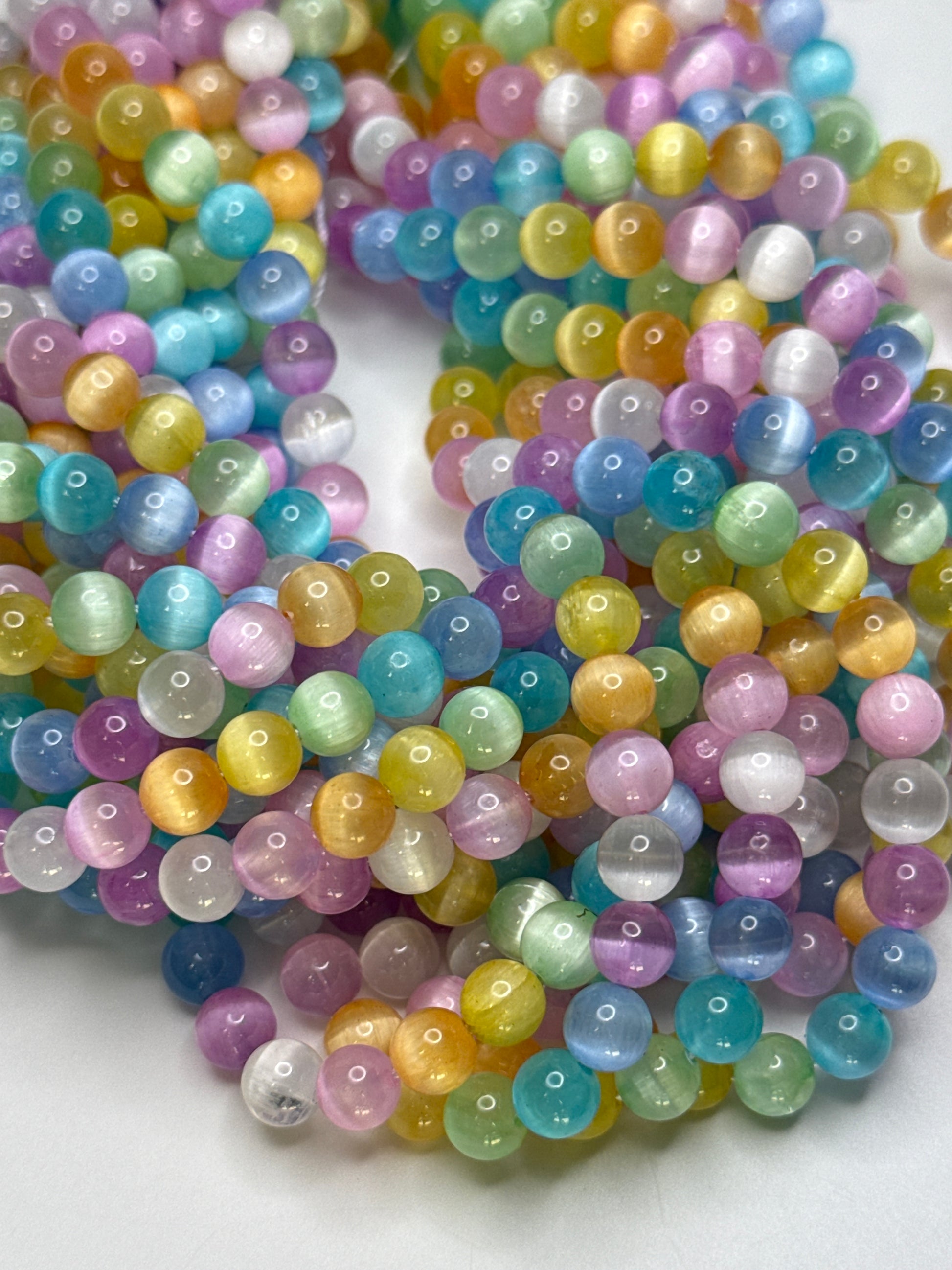 6mm Dyed Selenite Candy Smooth Round.