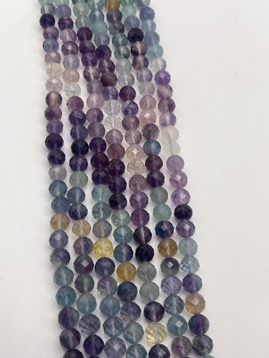 6mm Fluorite Faceted Round Bead Strand.