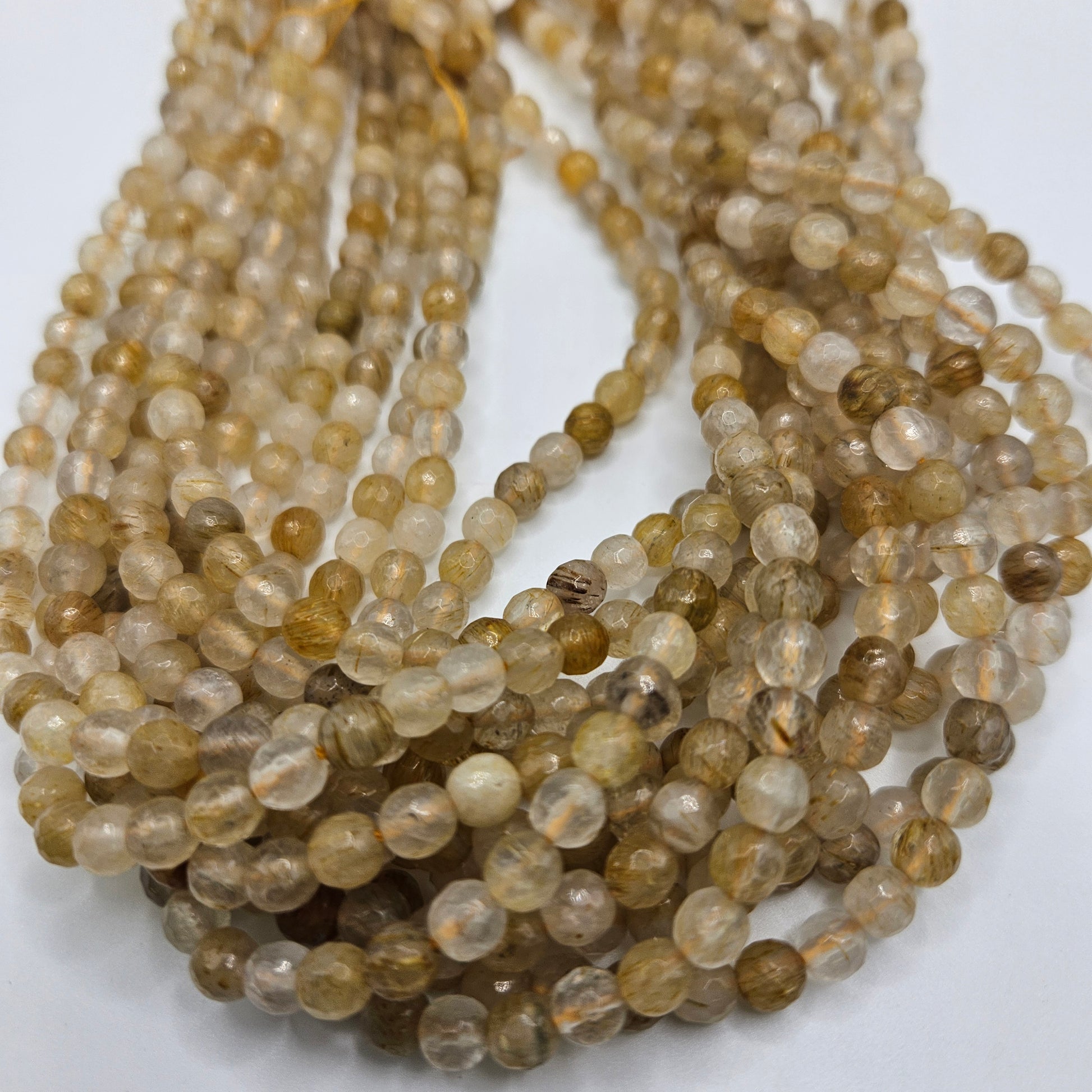 6mm Gold Rutilated Quartz Faceted Round Bead Strand.