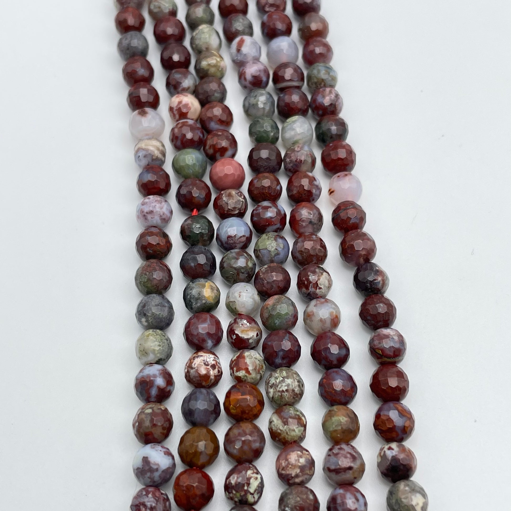 6mm Red Lightning Agate Round Faceted Bead Strand.