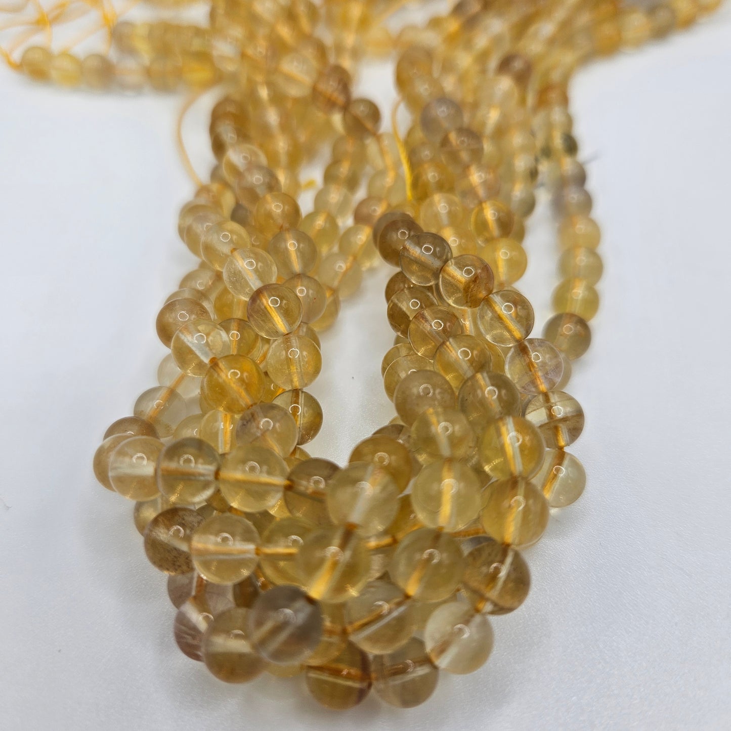 6mm Yellow Fluorite Round Bead Strand.