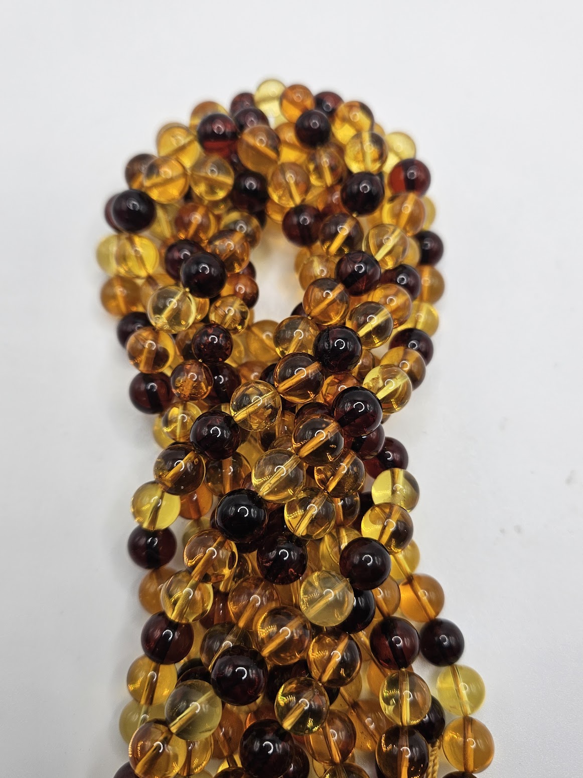 6mm Multi color Amber bead strand.