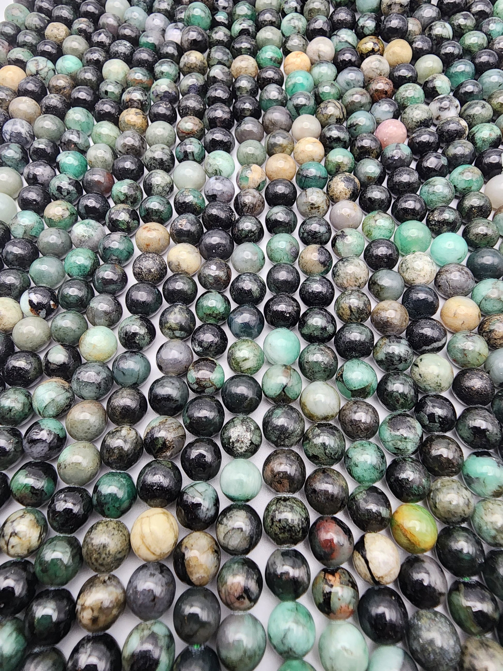 7mm Emerald Round Bead Strand.