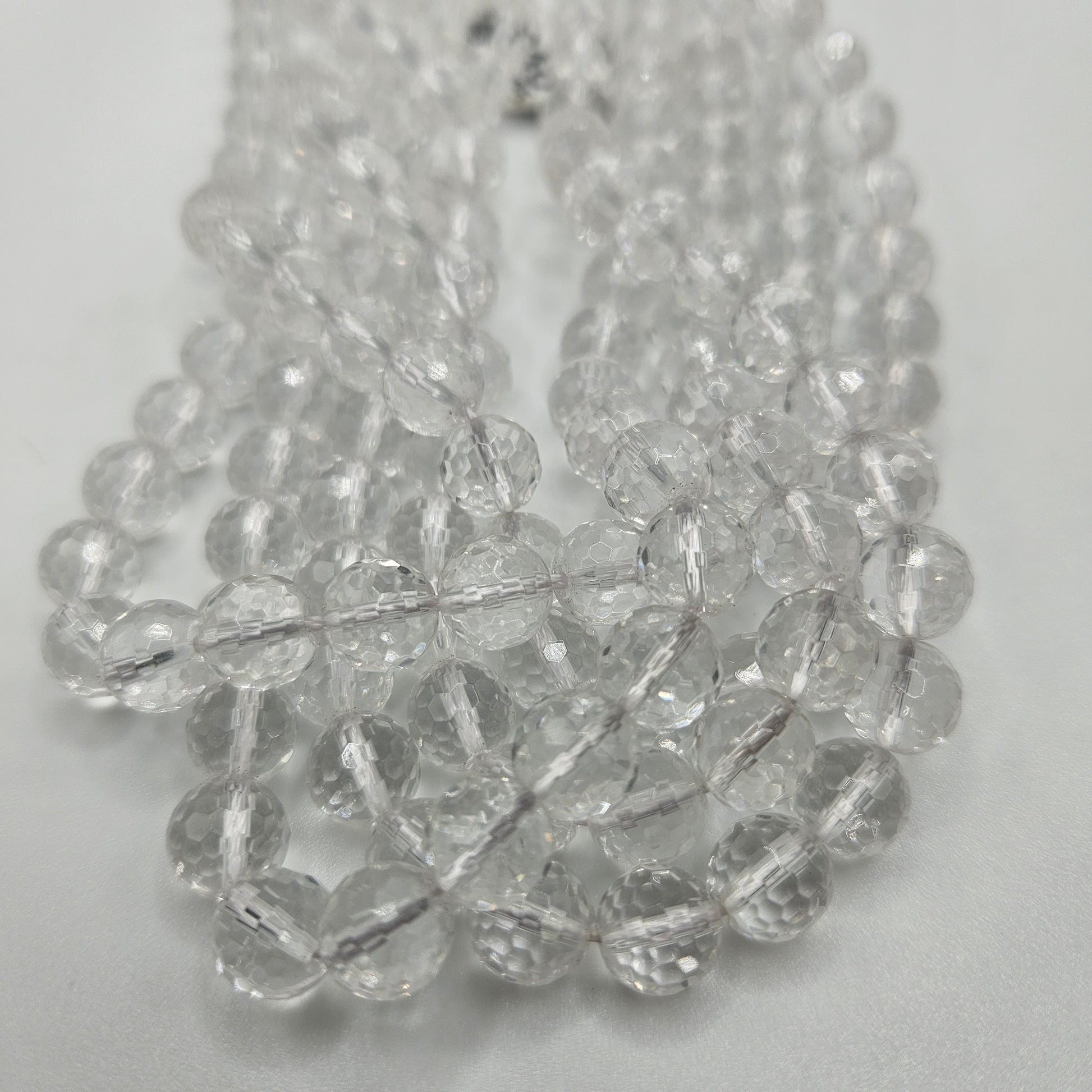 8mm Clear Quartz Faceted Round Bead Strand.