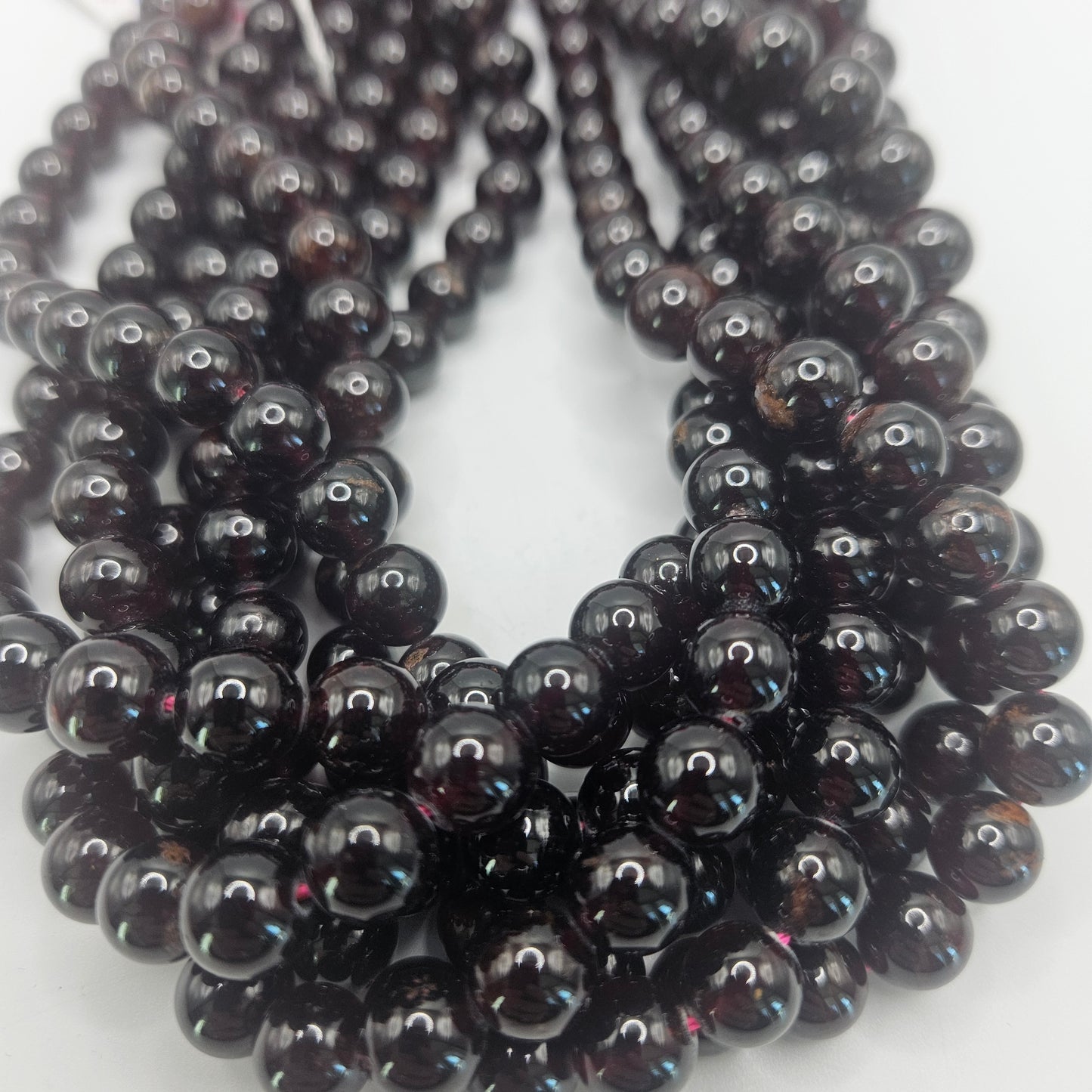 8mm garnet round bead strand.