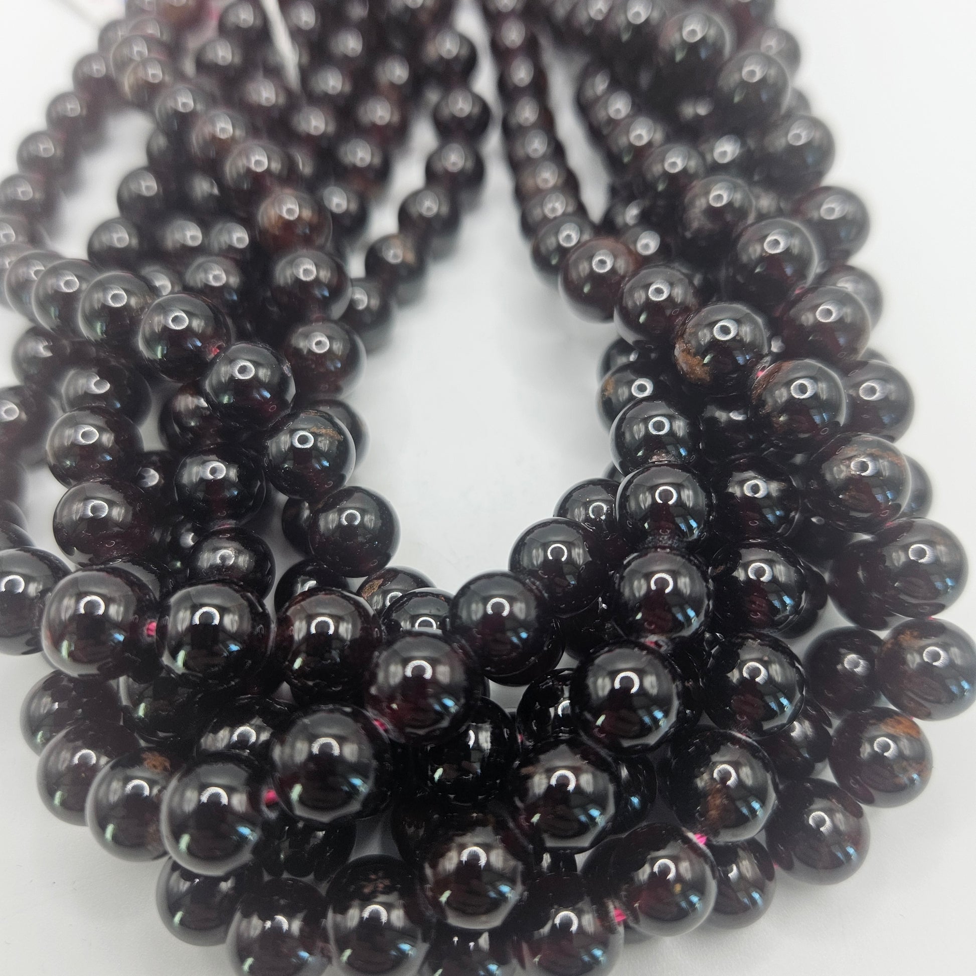 8mm garnet round bead strand.