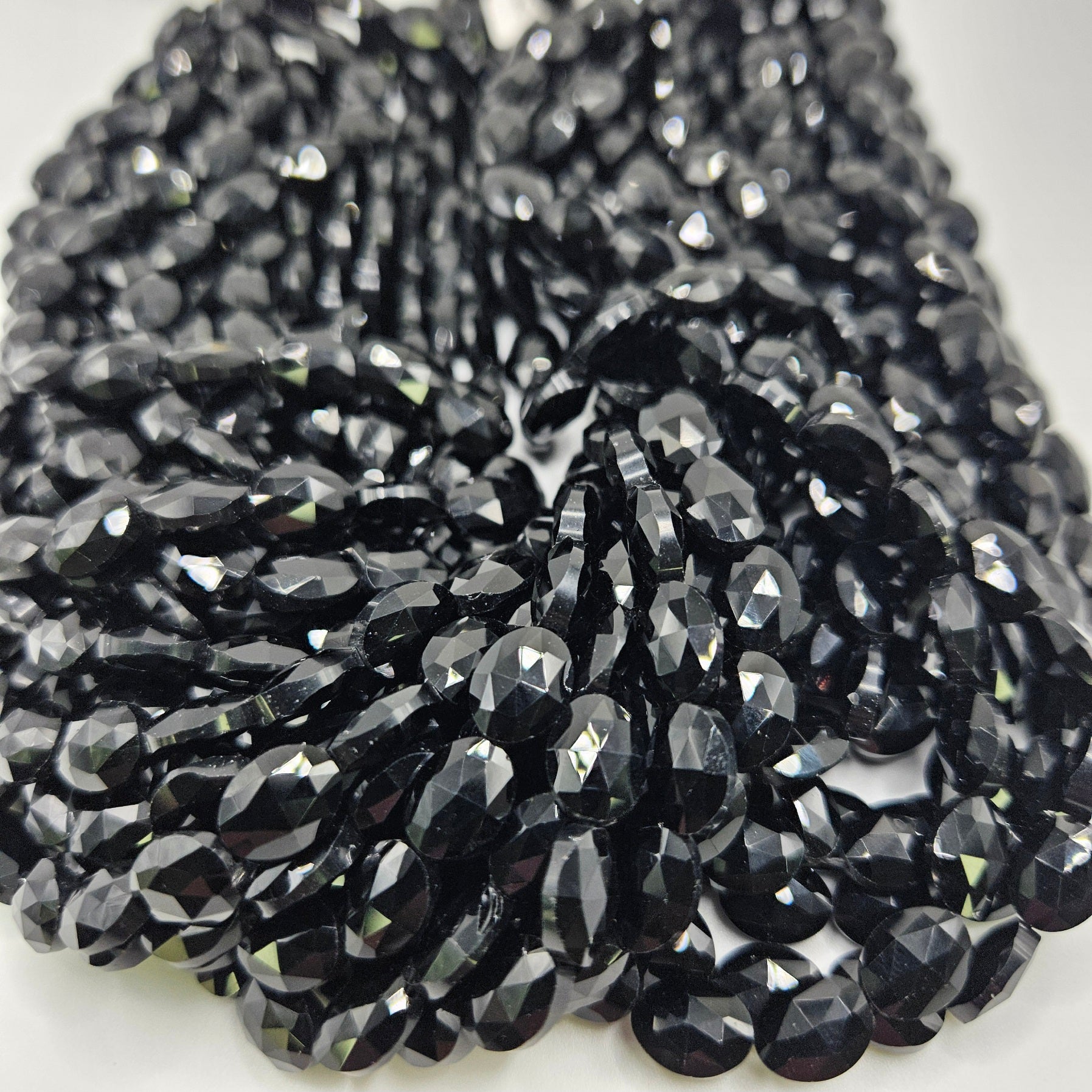 8mm Obsidian Faceted Oval Bead Strand.
