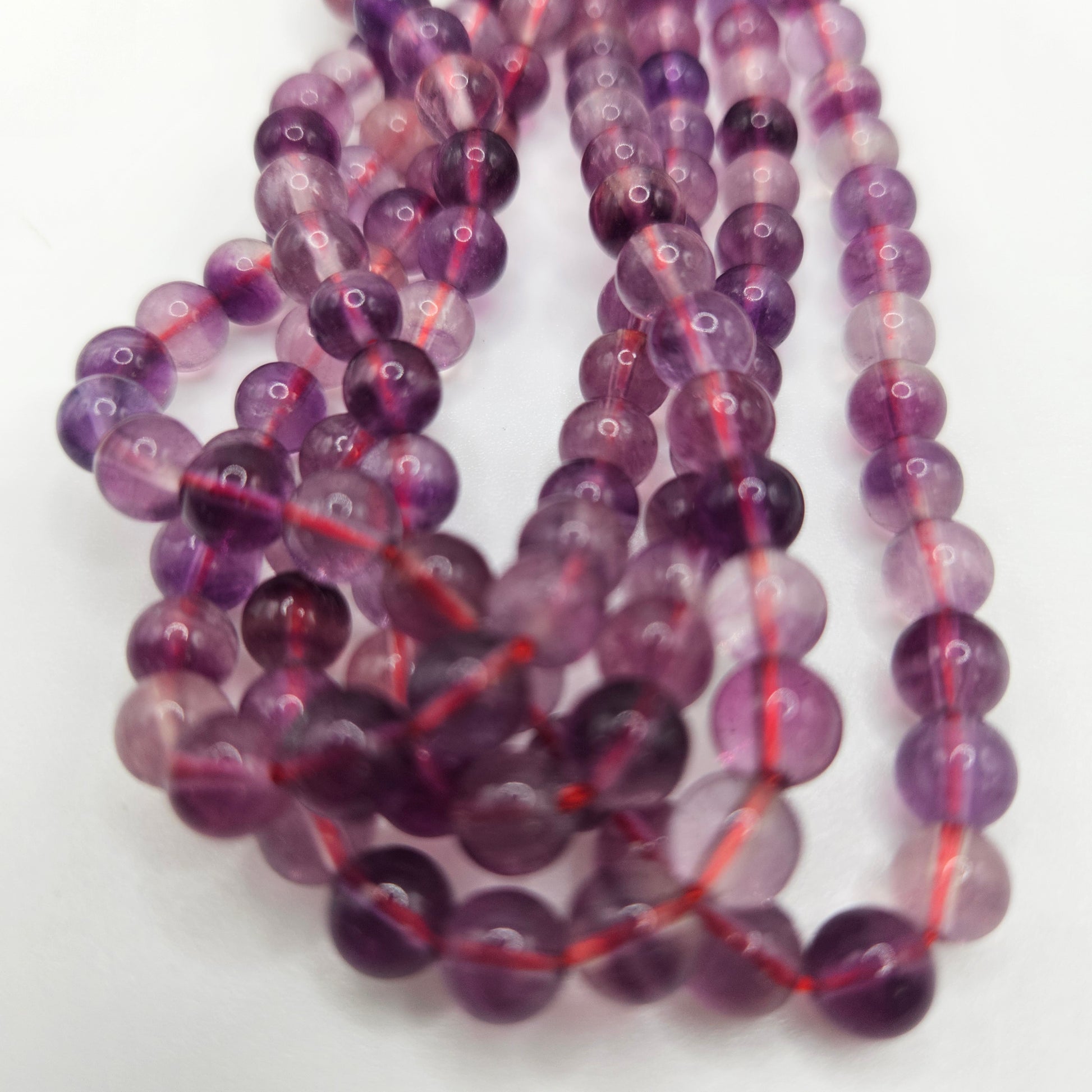 8mm Purple Fluorite Round Bead Strand.