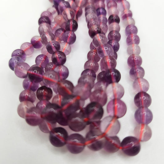 8mm Purple Fluorite Round Bead Strand.