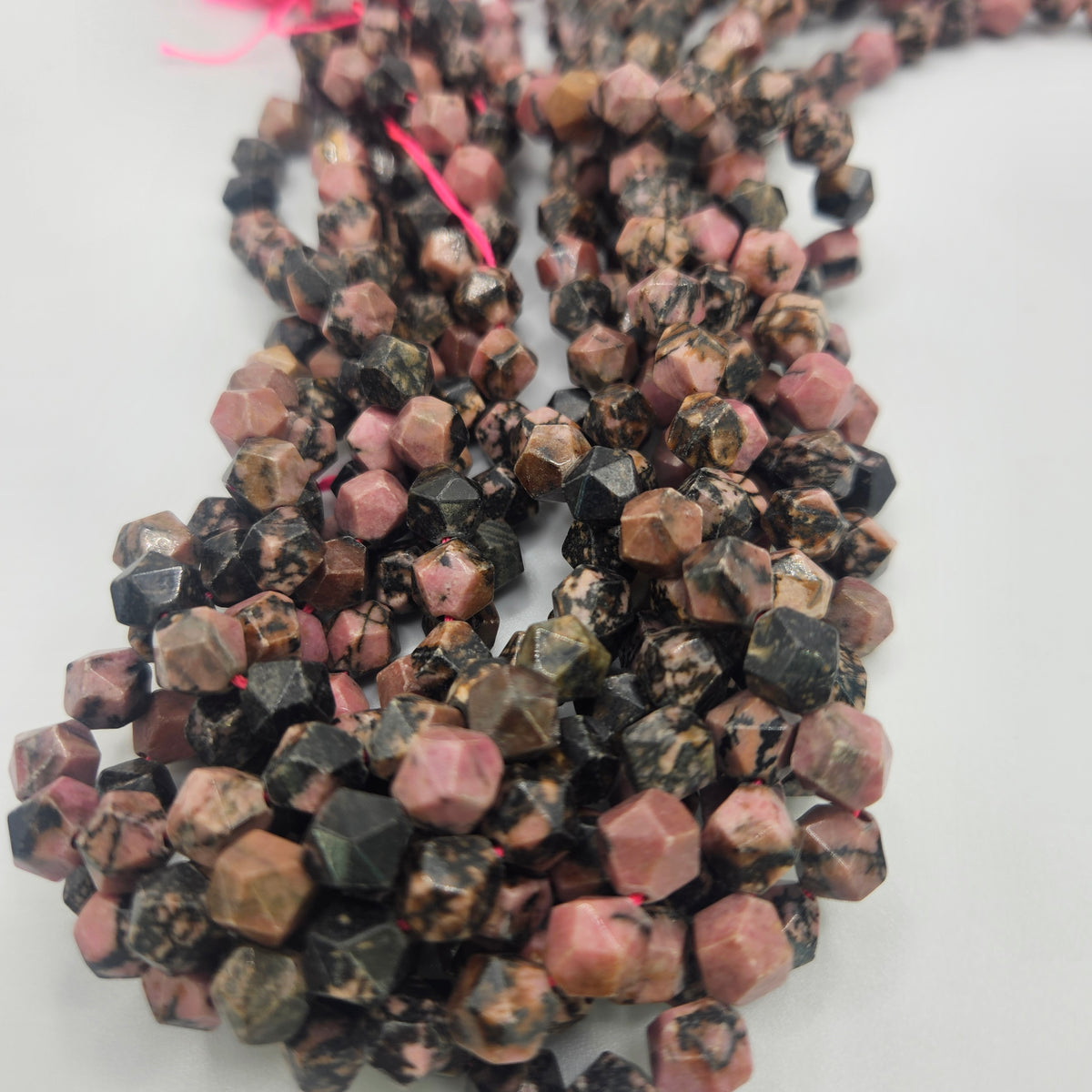 8mm Rhodochrosite Fancy Cut Bead Strand.