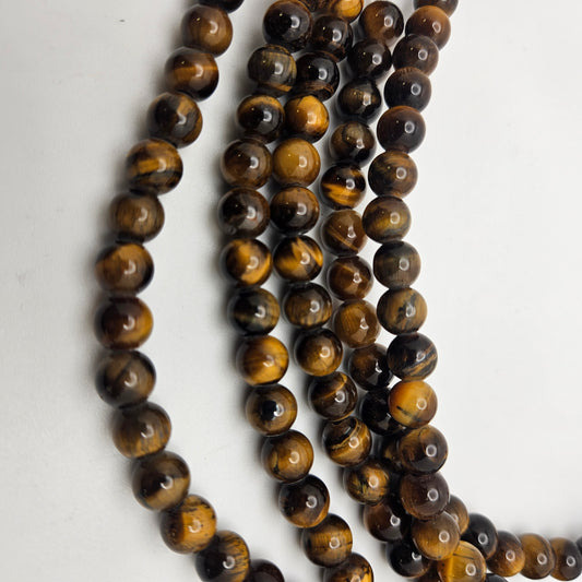 8mm Tiger Eye Large Hole Round Bead Strand.