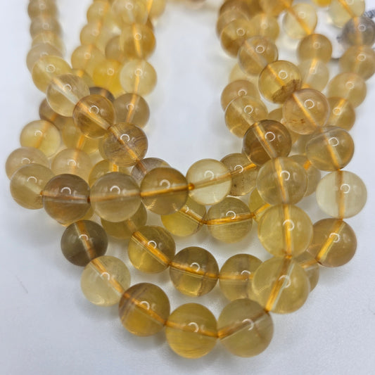 8mm Yellow Fluorite Round Bead Strand.