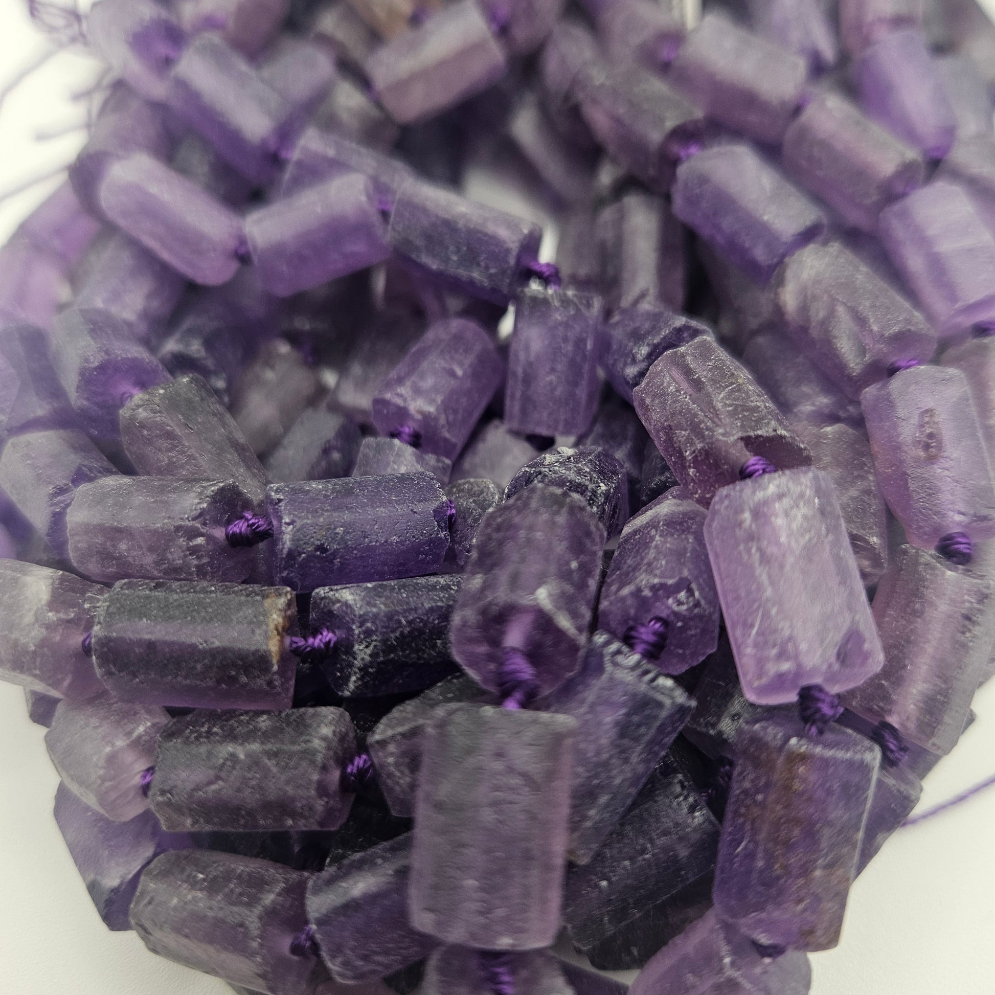 8x12mm Amethyst Rough Tube Bead Strand.