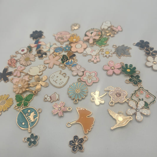 Assorted Flower Charms Gold Colored.