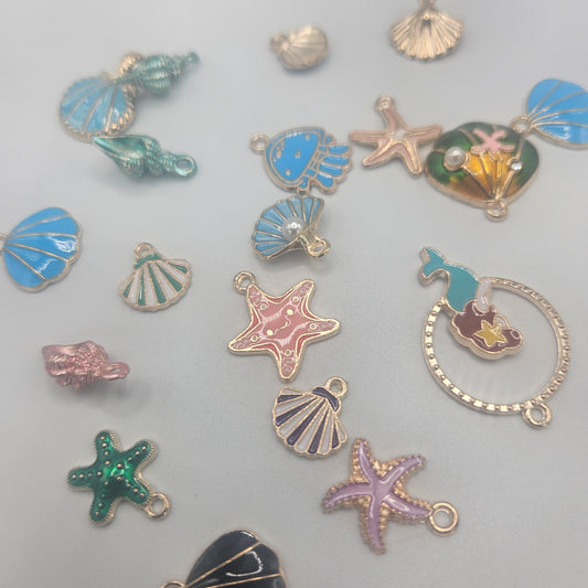 Assorted Ocean Charms Gold Colored.