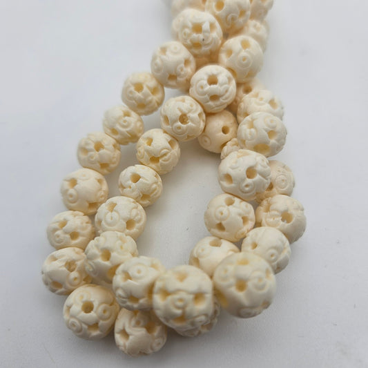 Decorative Carved Bone Bead Strand.