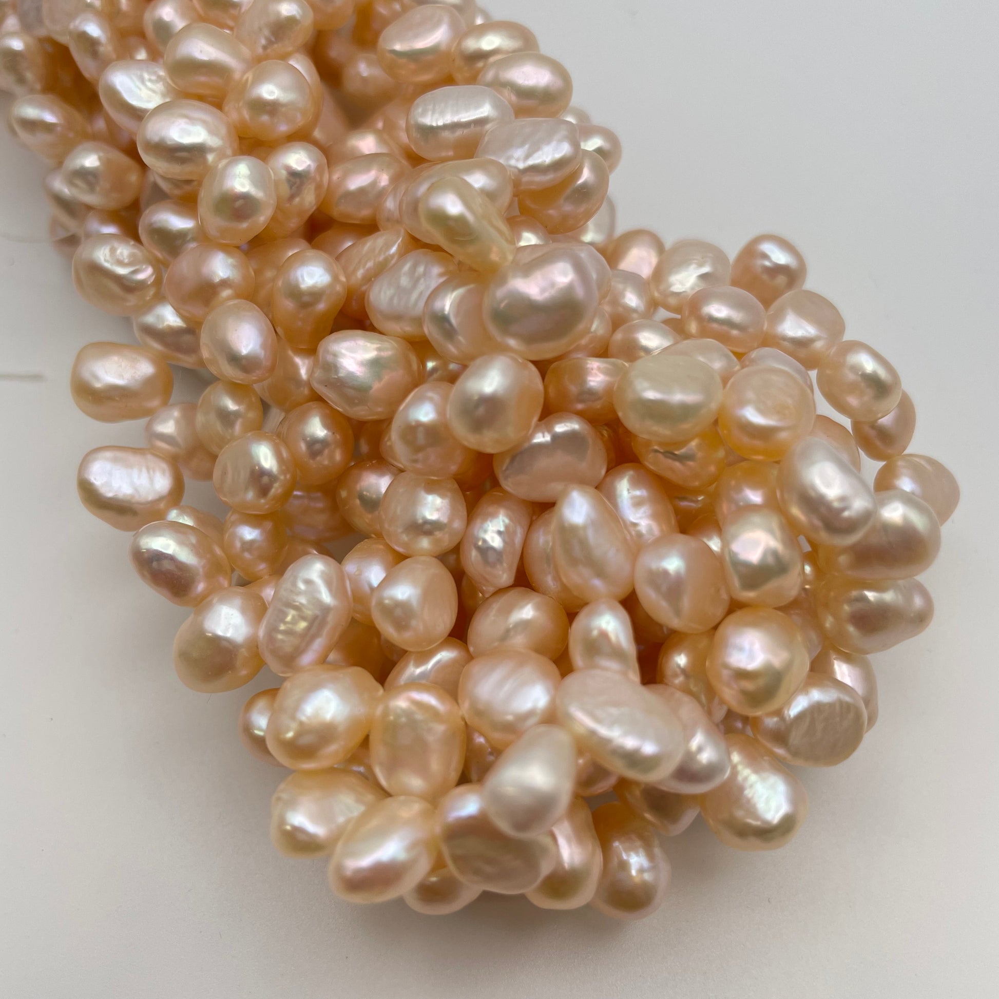 8mm Pink Pearl Dancing Top Drill Strand