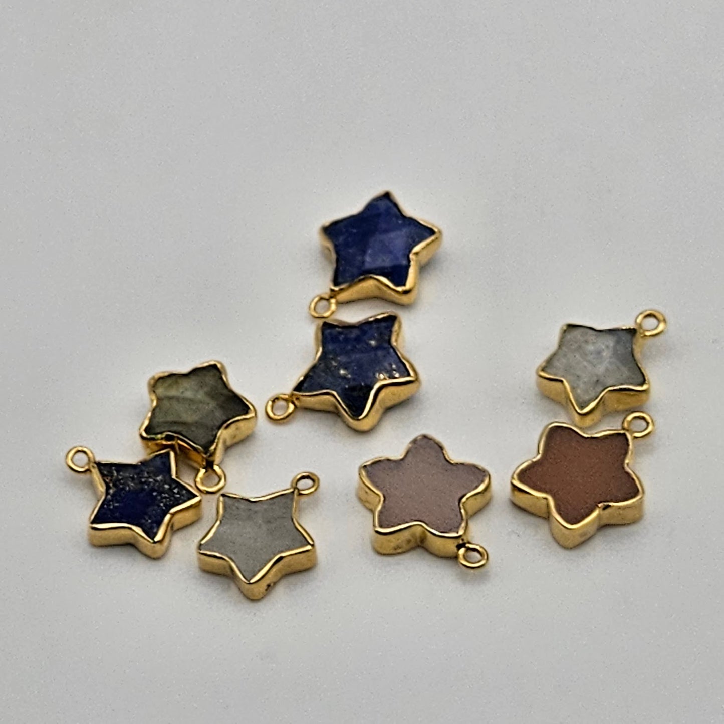 Gold Plated Assorted Star Charm.