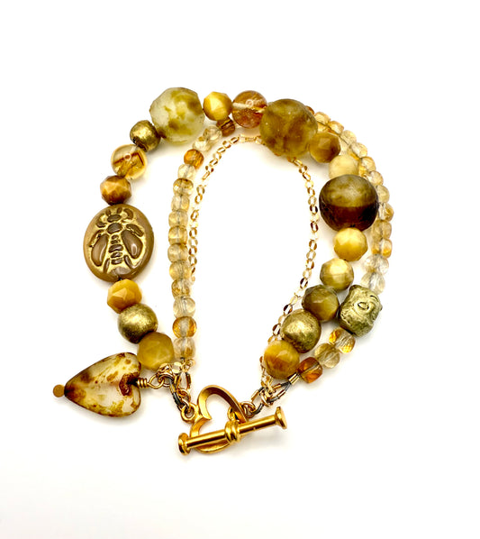 Golden Honey 3 strand statement bracelet. Citrine, yellow tigers eye, Czech glass, African beads with a vermeil heart toggle.