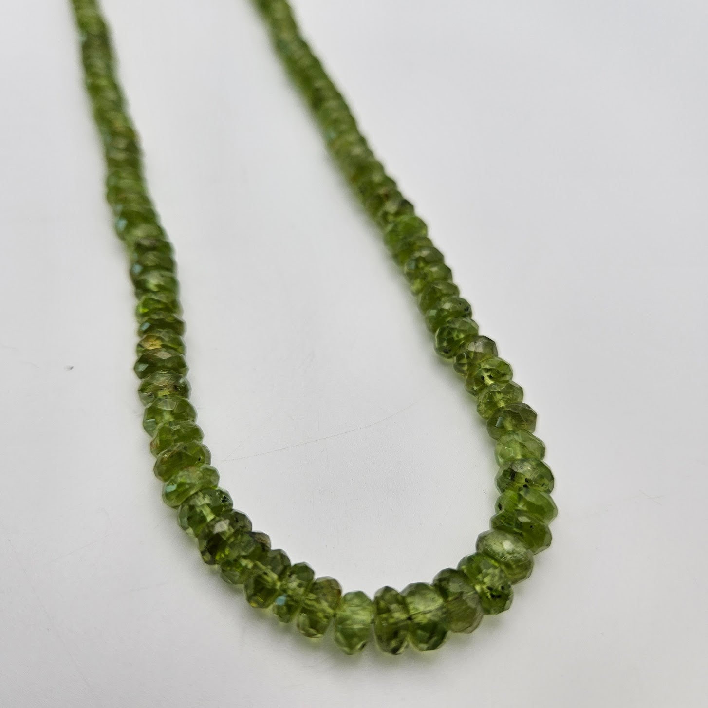 Graduated Faceted Peridot Bead Strand.