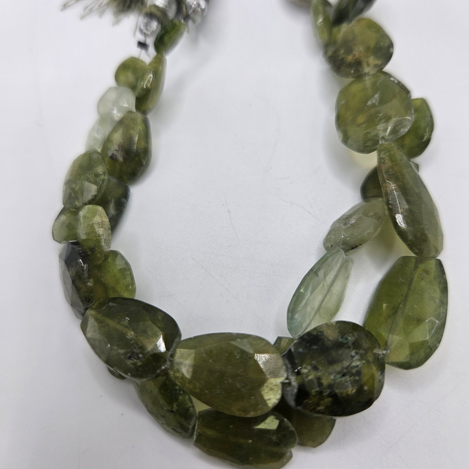 Multi Size Faceted Peridot Bead Strand.
