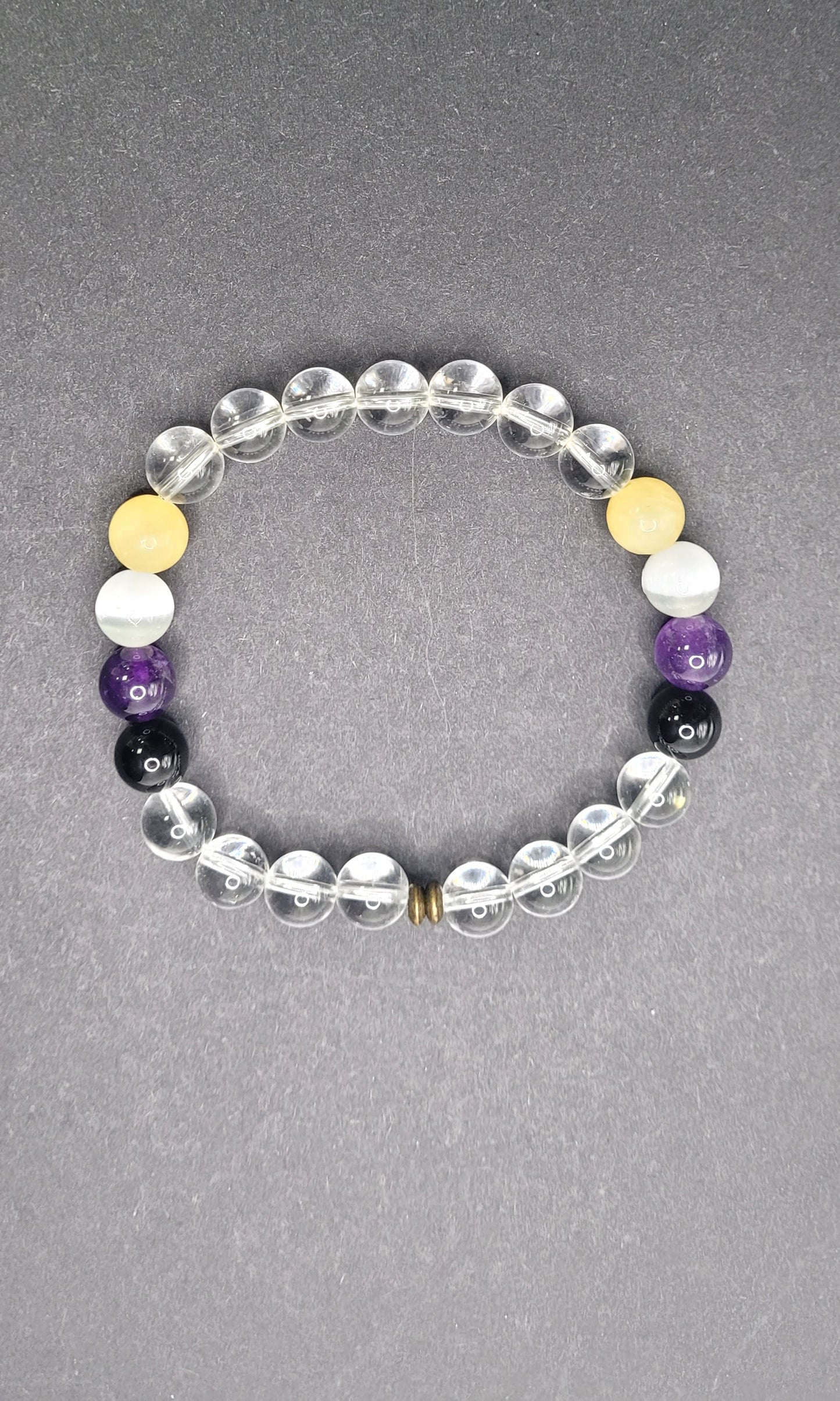 Non Binary Flag Stretch Bracelet. Pattern and design vary.