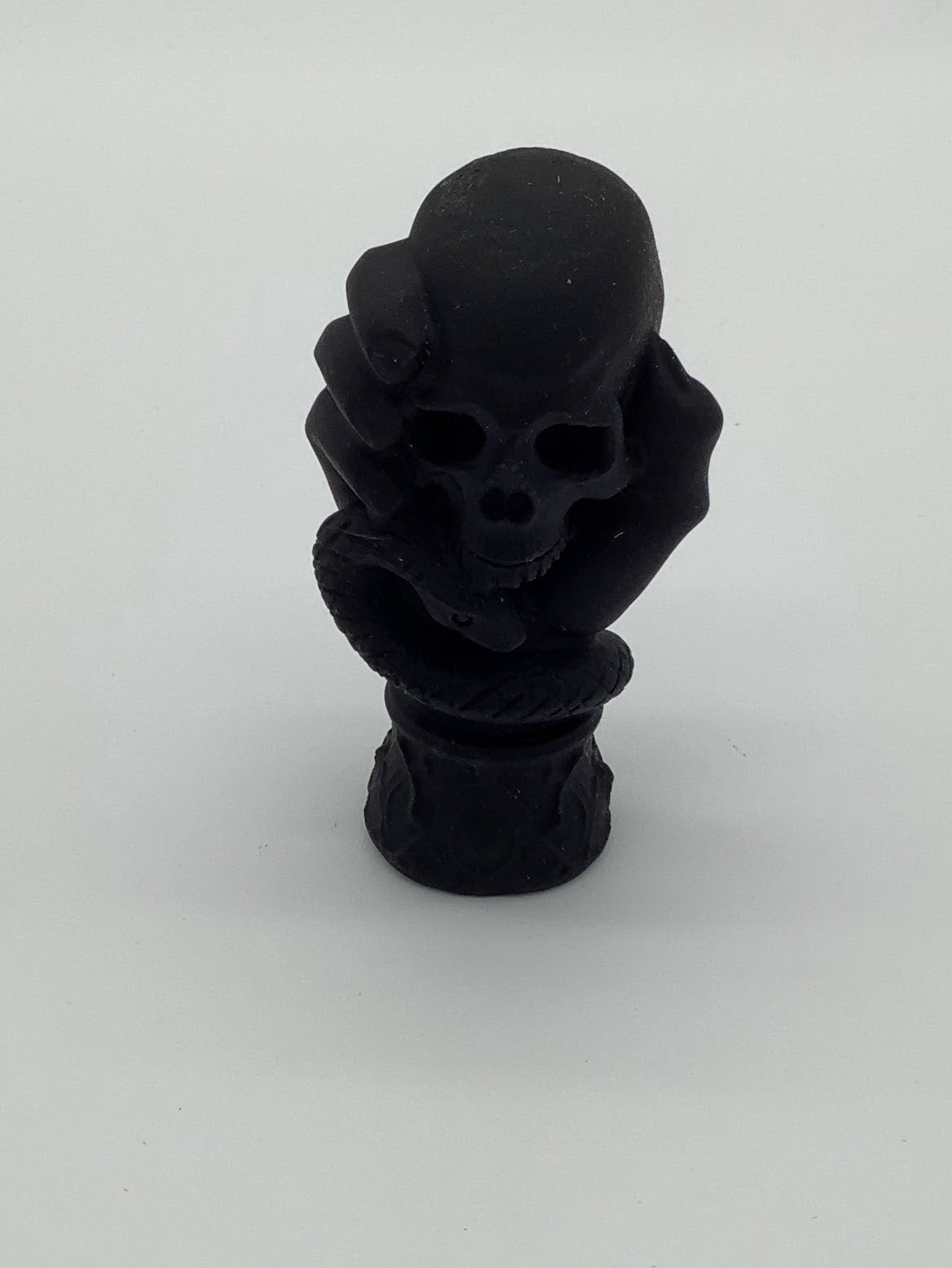 Obsidian Skull in Hand.