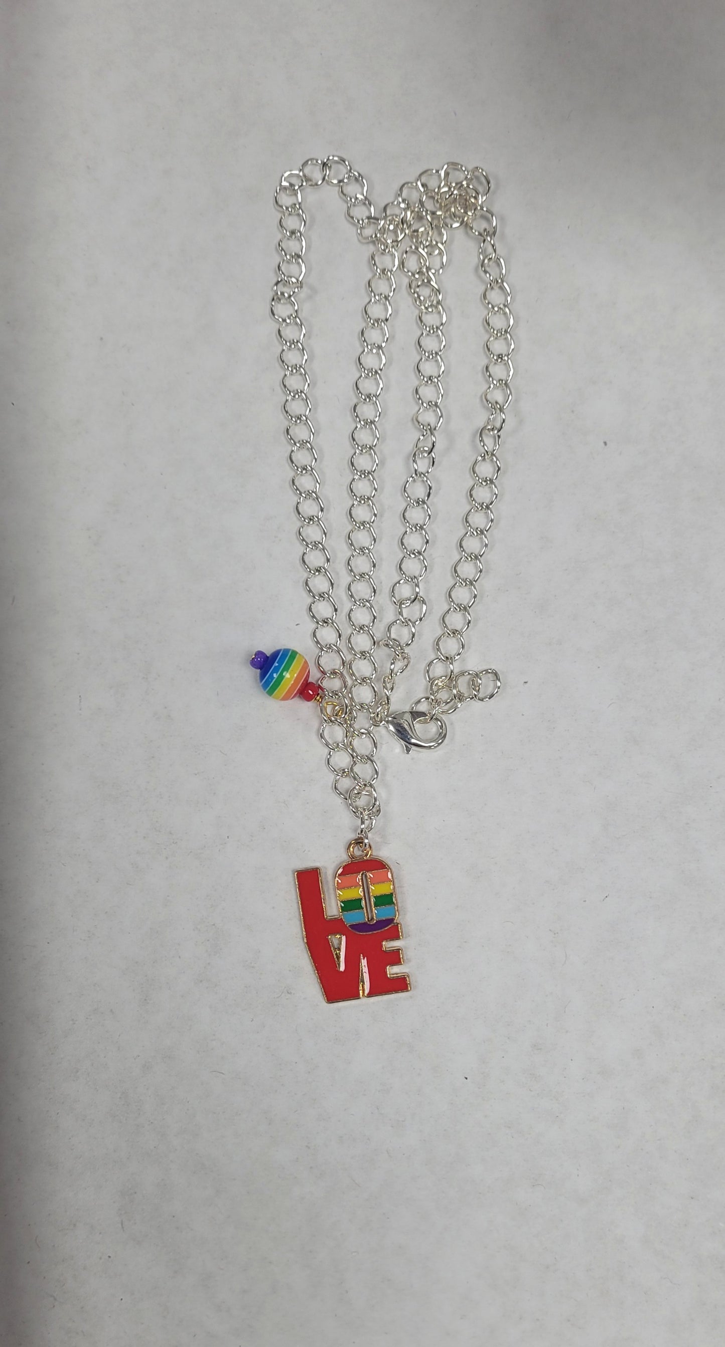 Pride Silver Charm Necklace. Charm chosen at random. Charms vary.