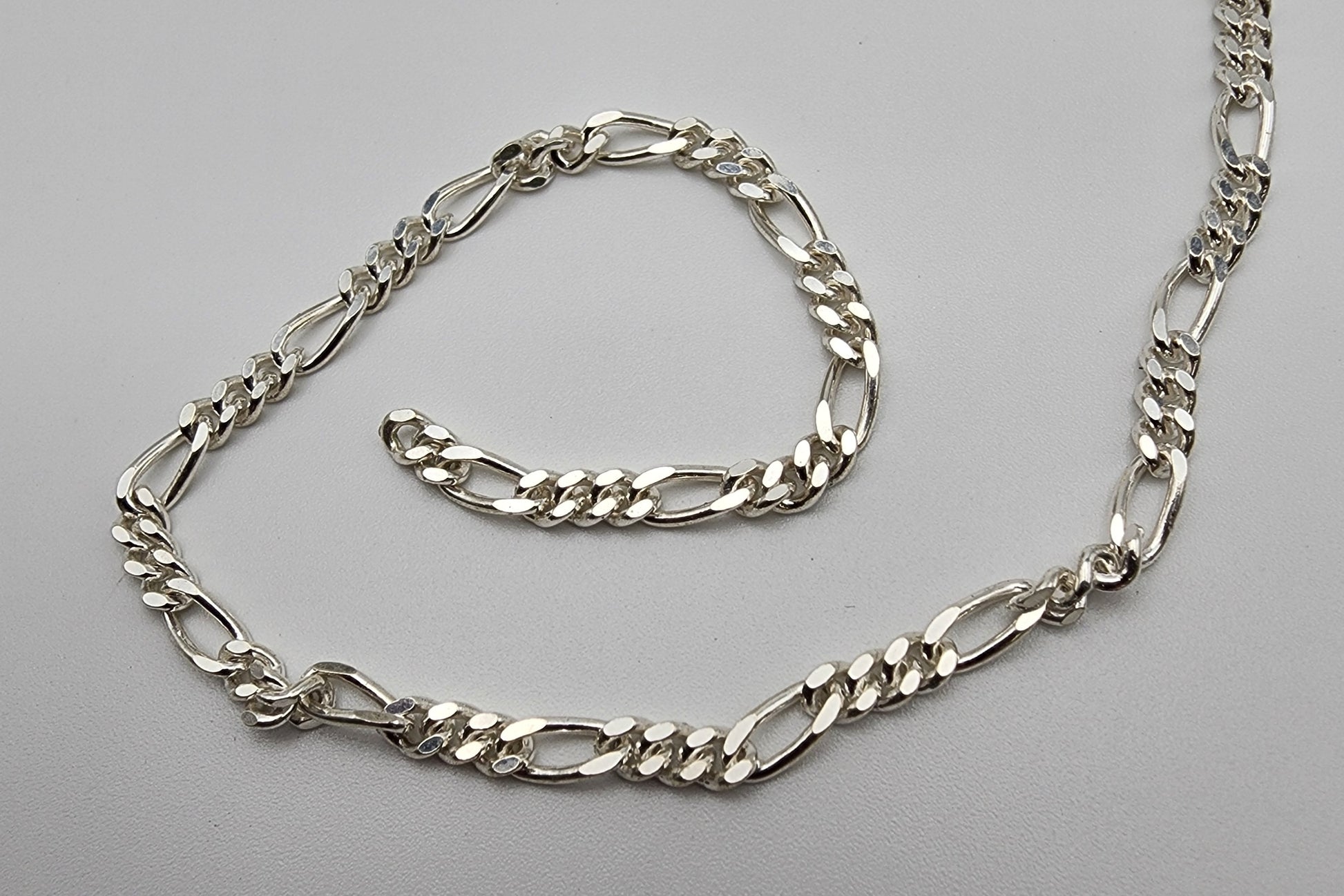 Sterling Silver Flat Diamond Figaro Large 2mm Chain Sold Per Foot.