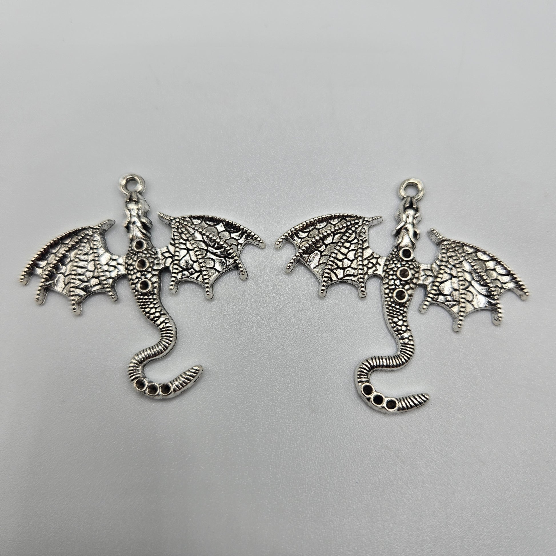 Silver Colored Flying Dragon Charm 1.5x1.5 inch.