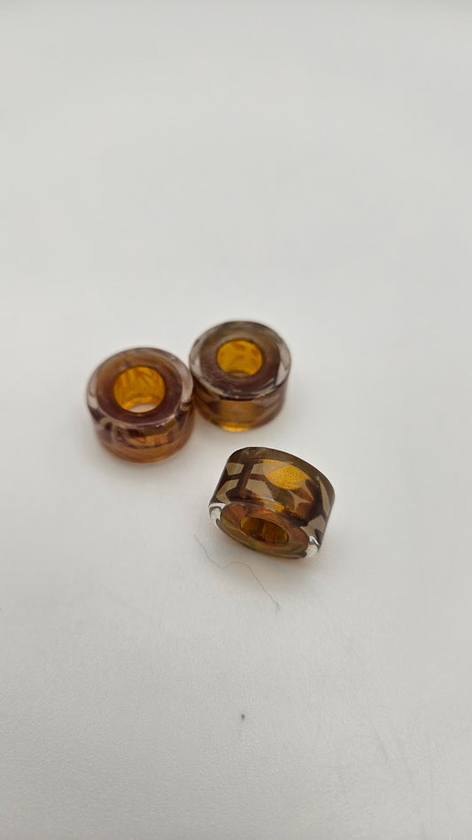 Small Brown Snowflake Glass Bead.