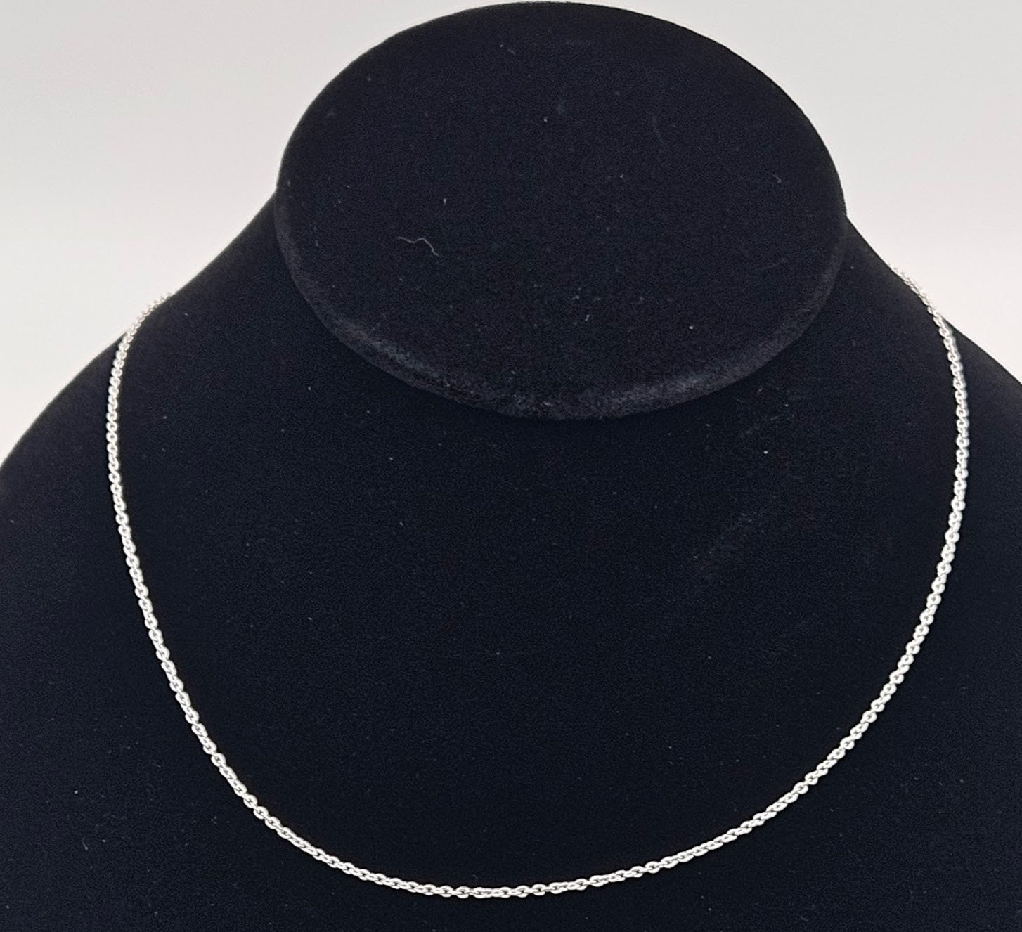 Sterling silver 18in cable.