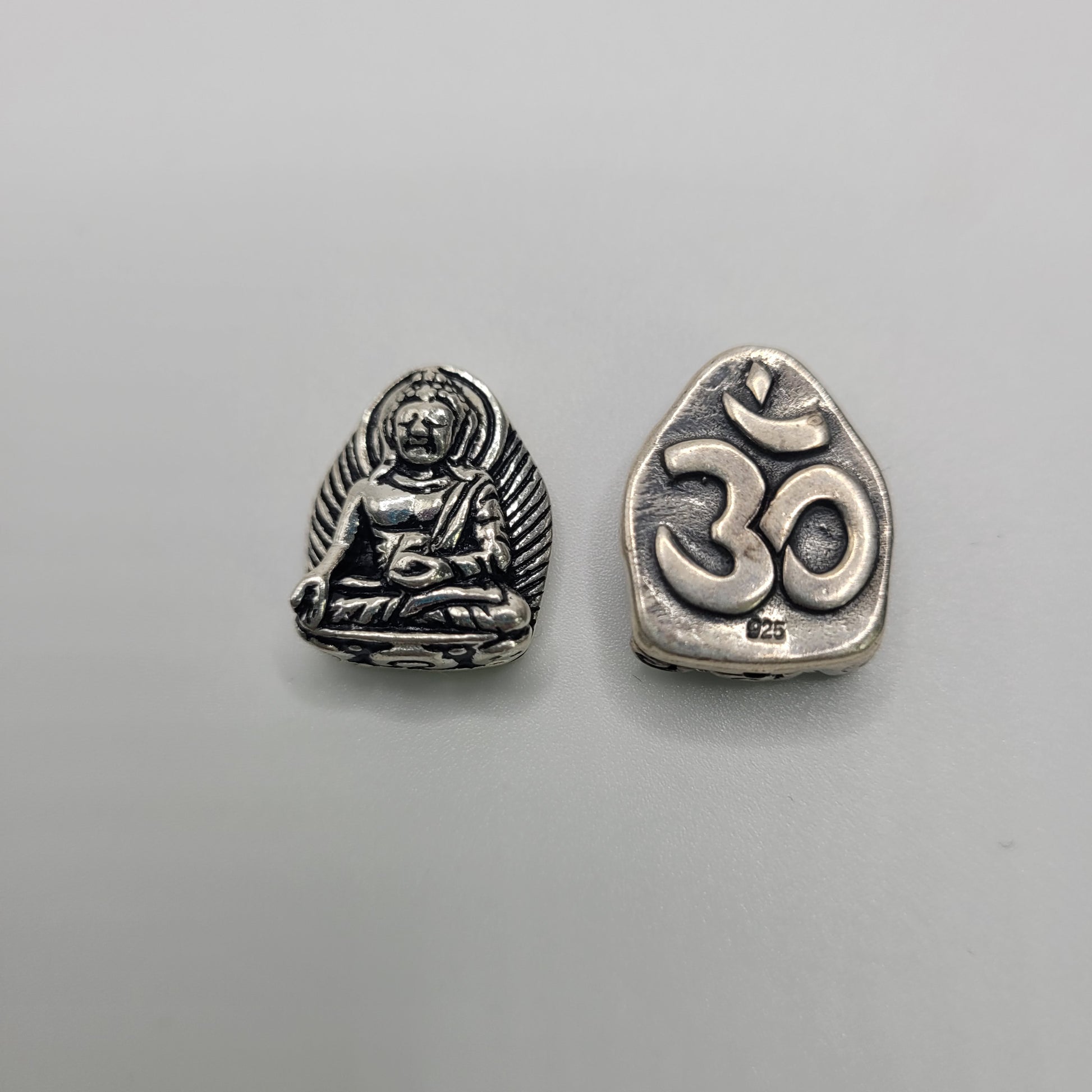 Sterling Silver Buddha Bead With Ohm Symbol on Back.