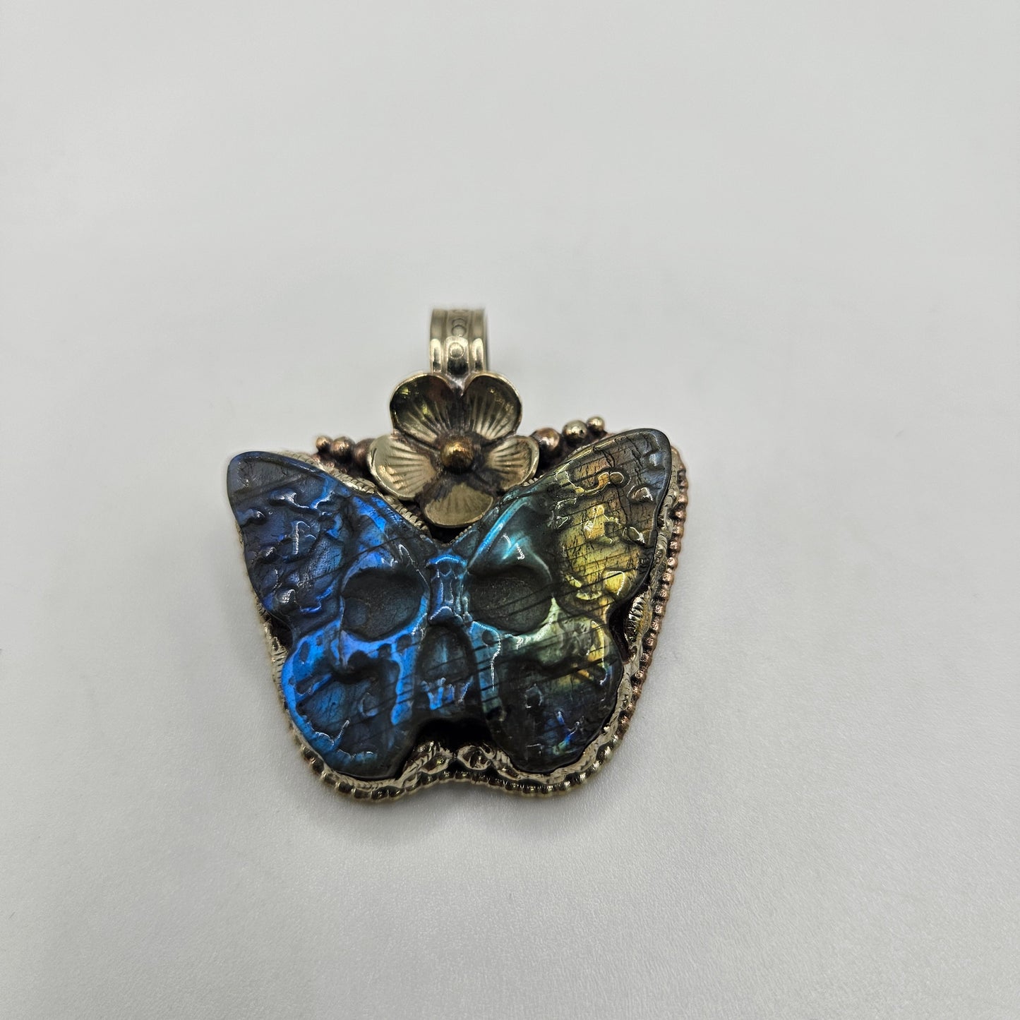 Sterling Silver Carved Labradorite Butterfly Skull Pendant.