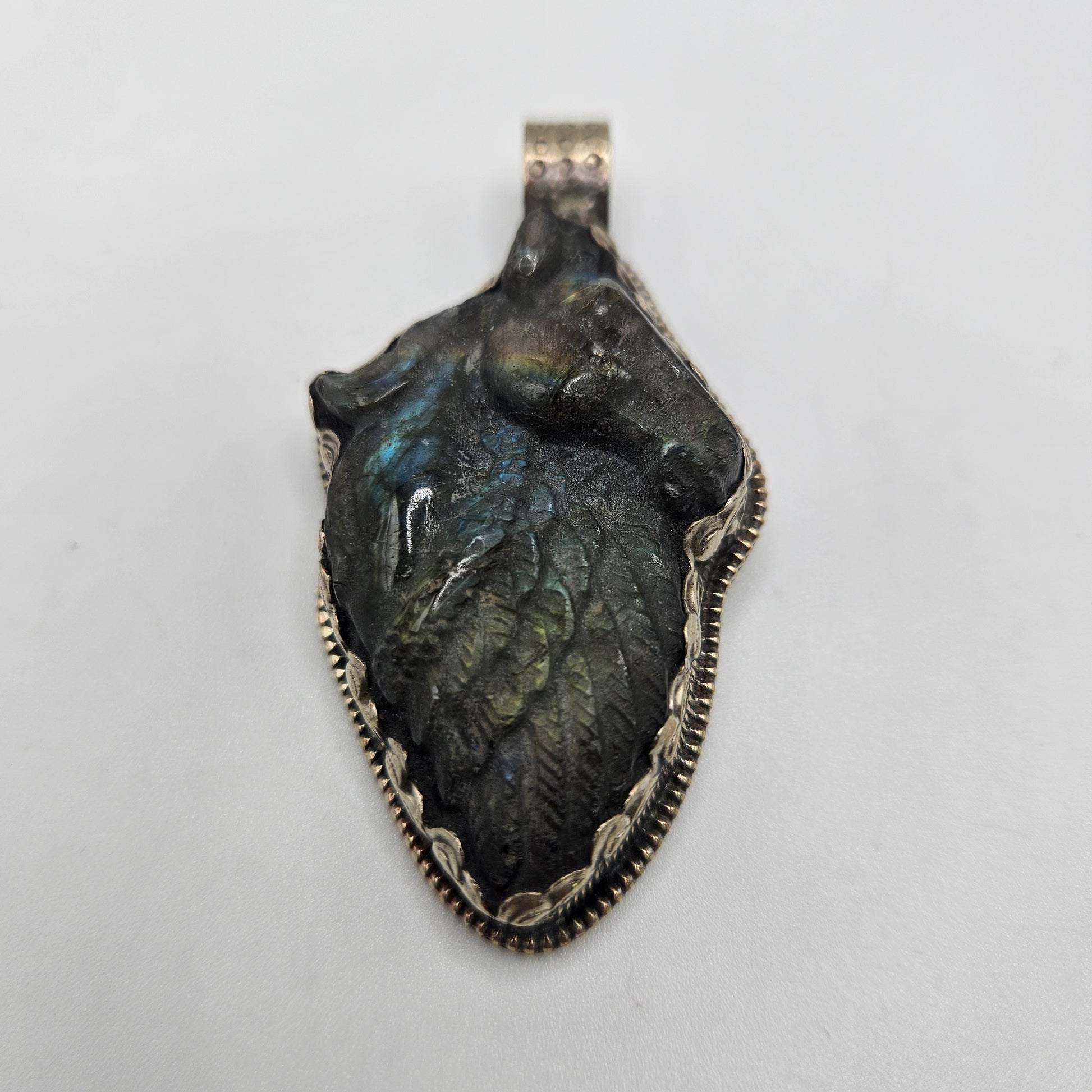Sterling Silver Carved Labradorite Horse Wing Pendant.
