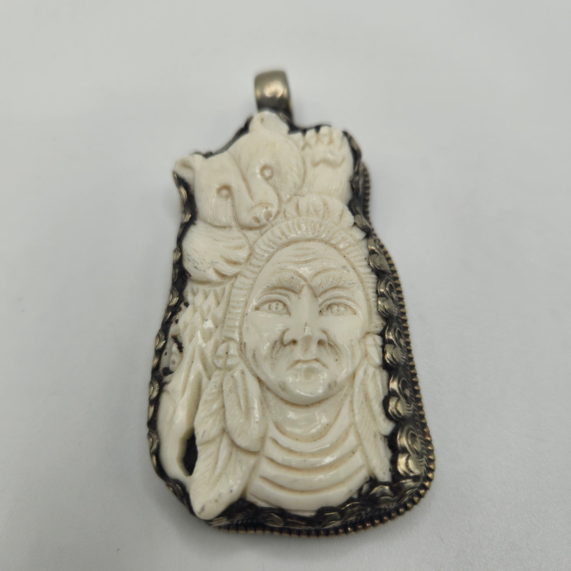 Sterling Silver Carved Ox Bone Bear Native American Pendant.