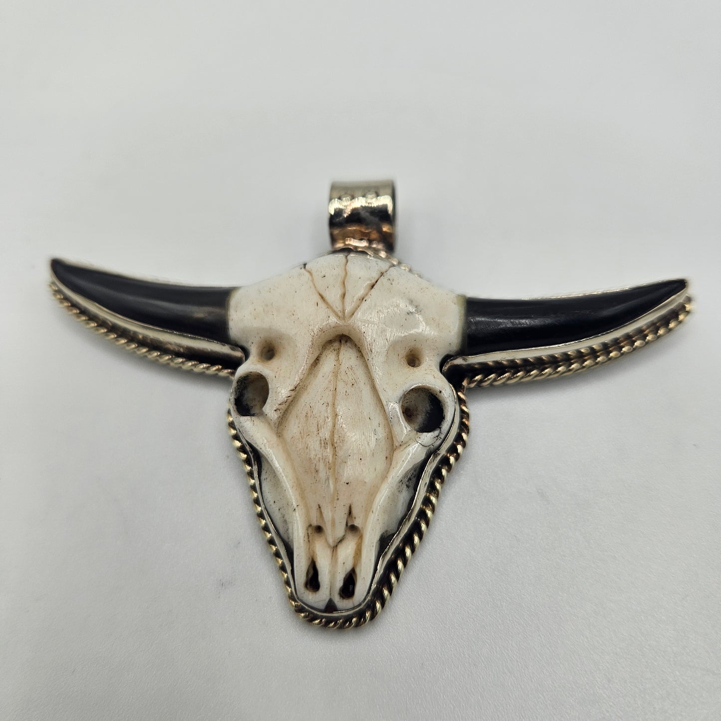 Sterling Silver Carved Ox Bone Black Onyx Pendant.