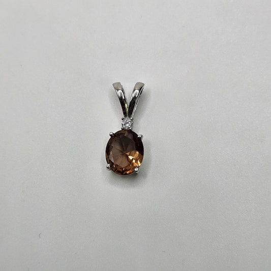 Sterling Silver Color Change Gemstone Oval with Diamond Pendant.