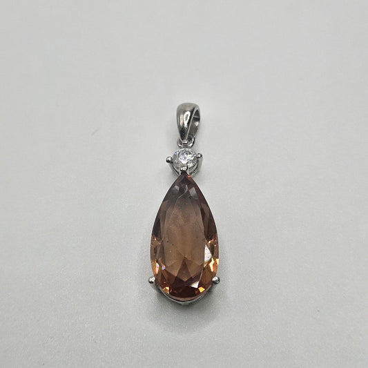 Sterling Silver Color Change Gemstone Teardrop with Diamond Pendant.