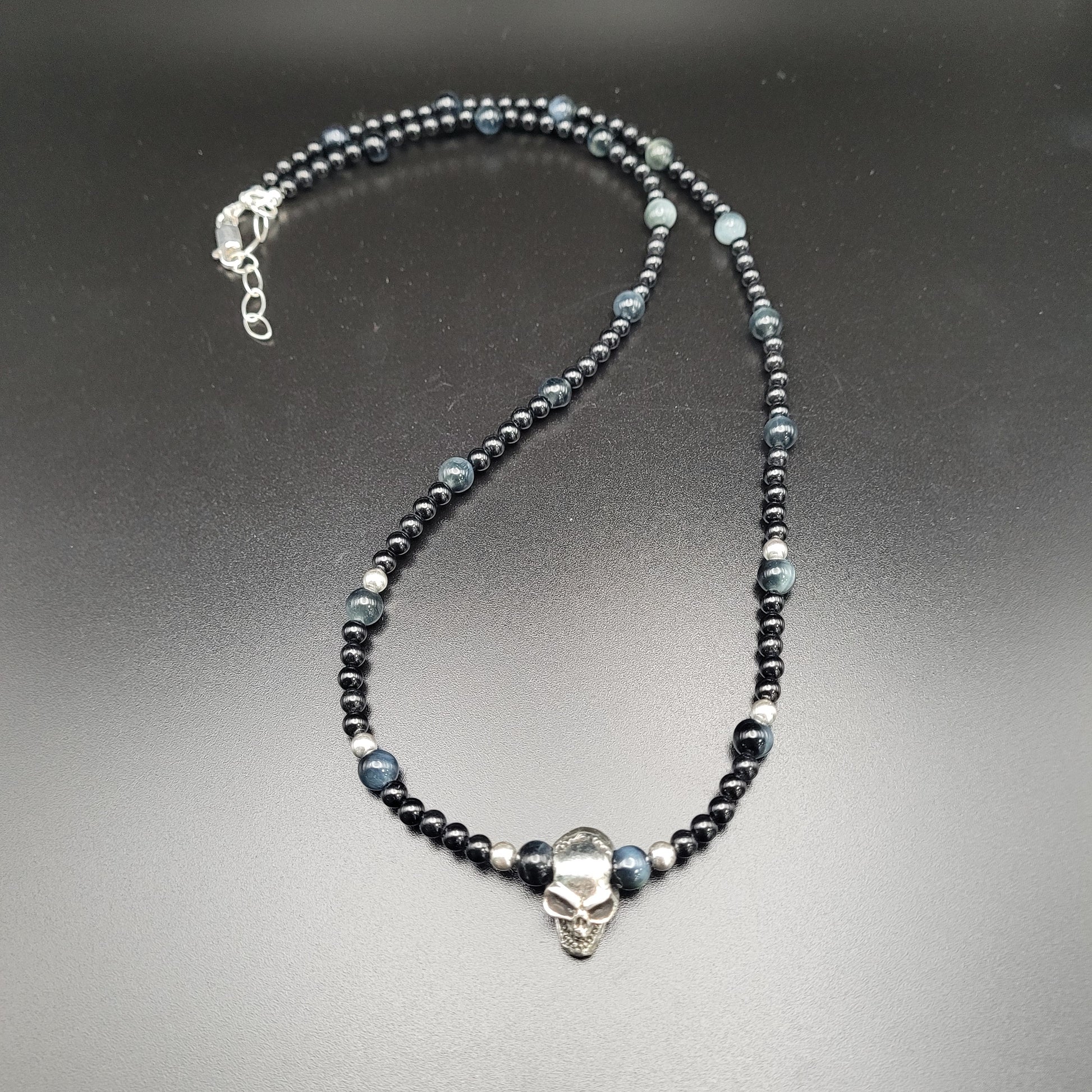 Sterling Silver Skull, Spinel, and Blue Tiger's Eye Necklace.