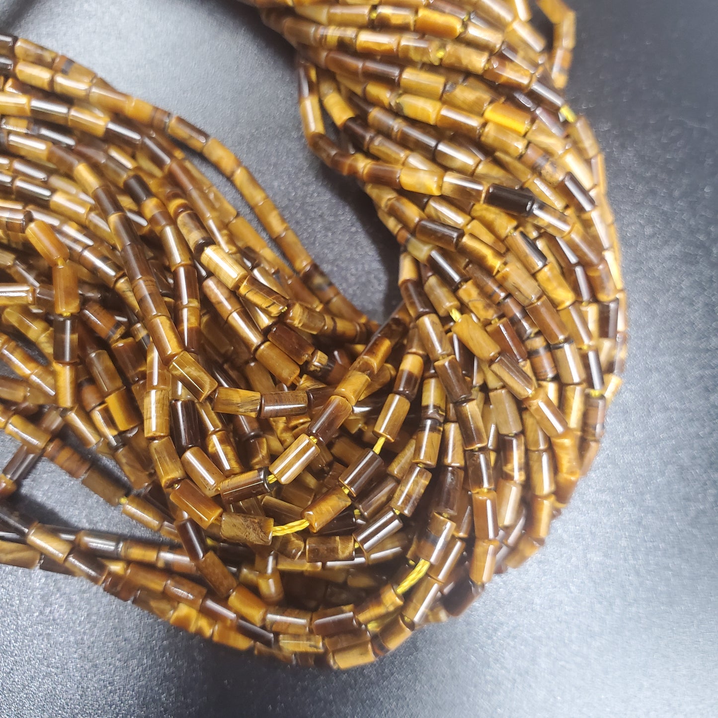 Tigers Eye 2x5mm Tube Bead Strand.