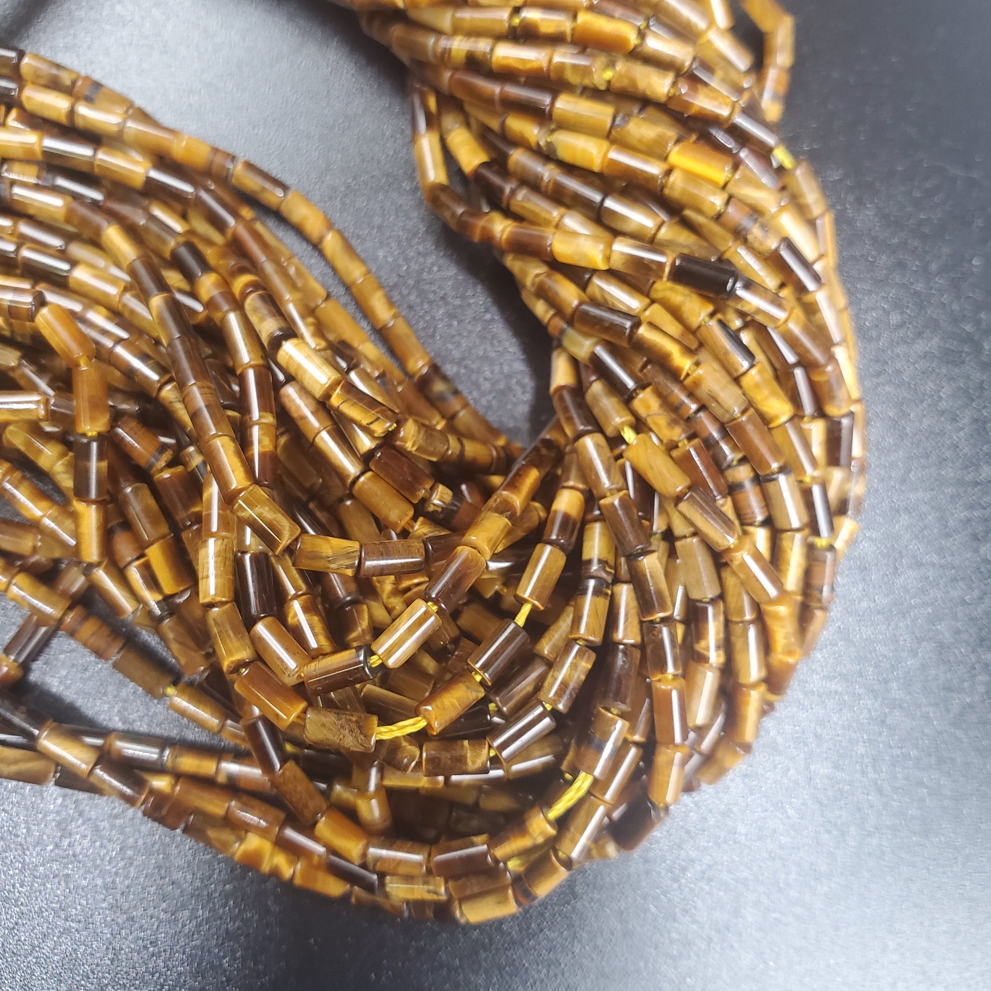 Tigers Eye 2x5mm Tube Bead Strand.