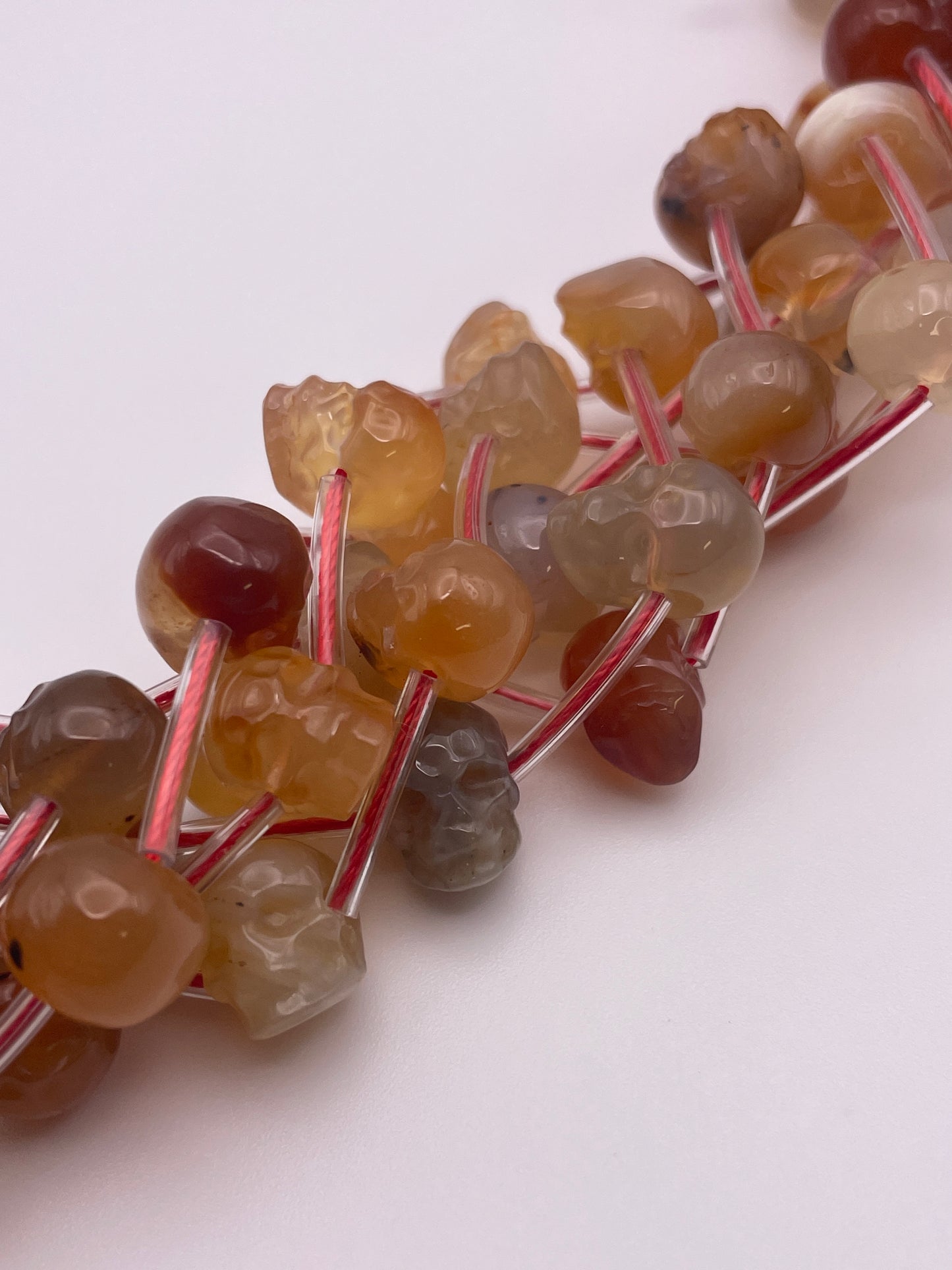 8mm Carnelian Skull Bead Strand