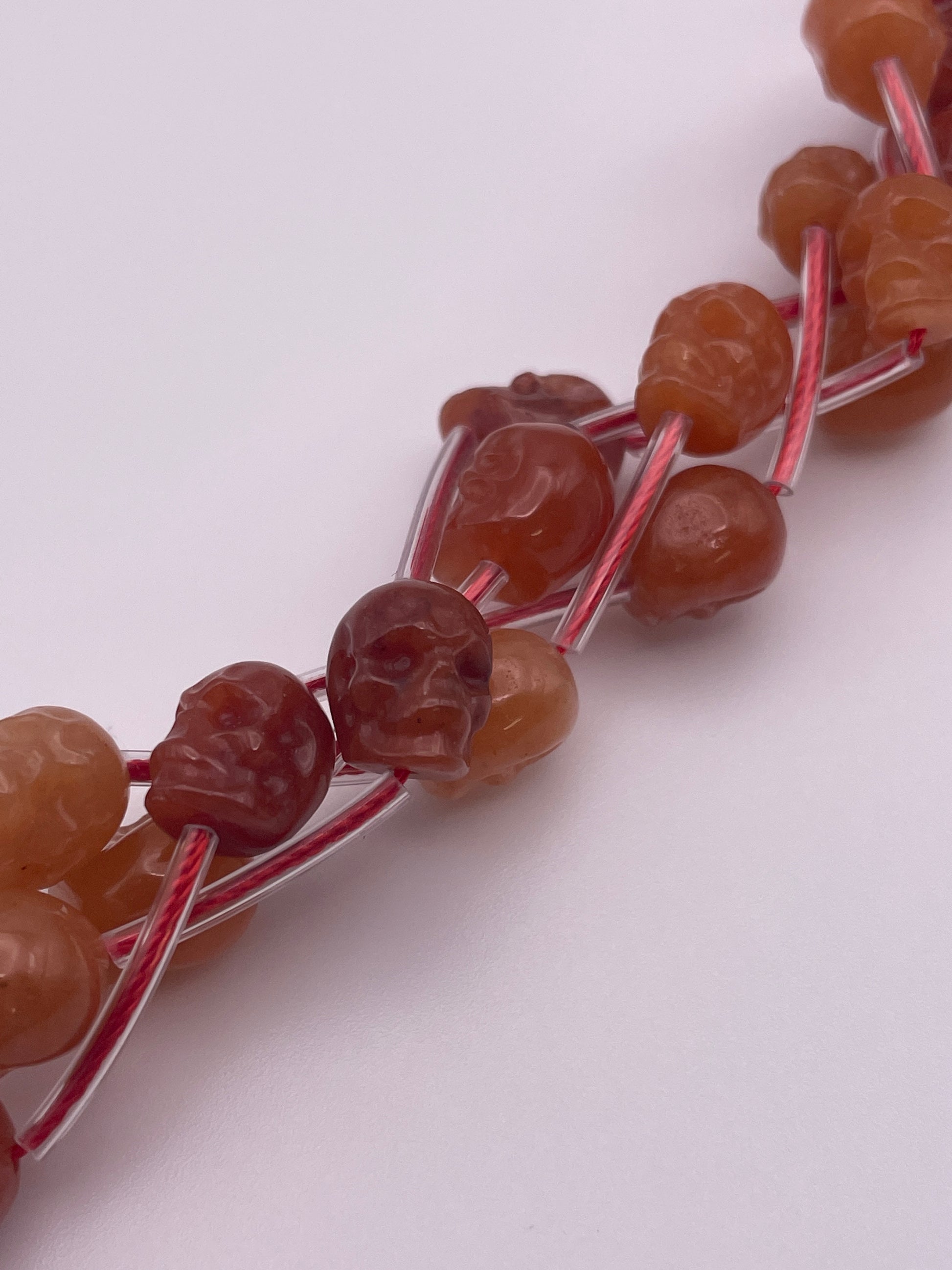 8mm Carnelian Vertical Drilled Skull Bead Strand