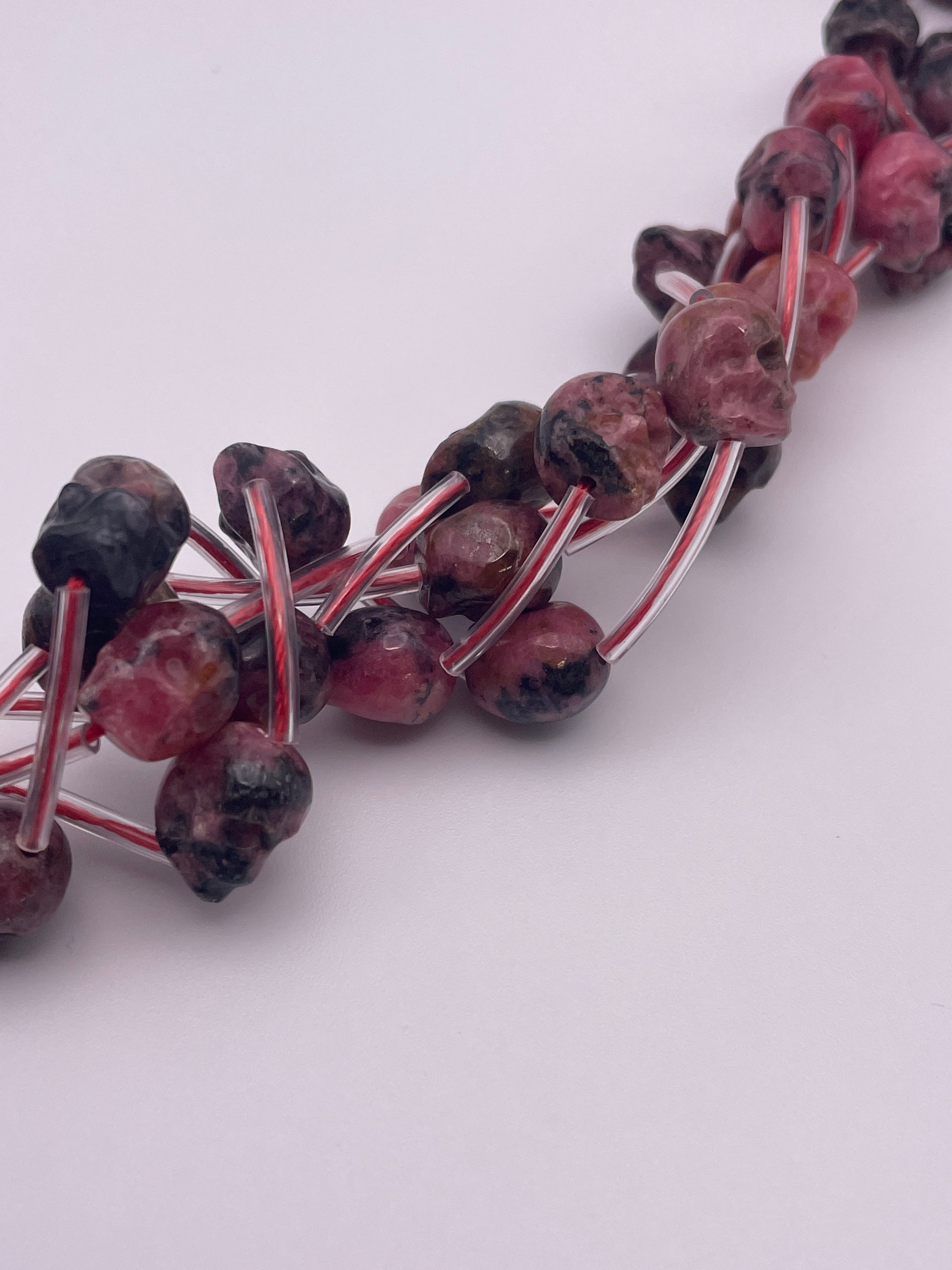 8mm Rhodonite Vertical Drilled Skull Bead Strand